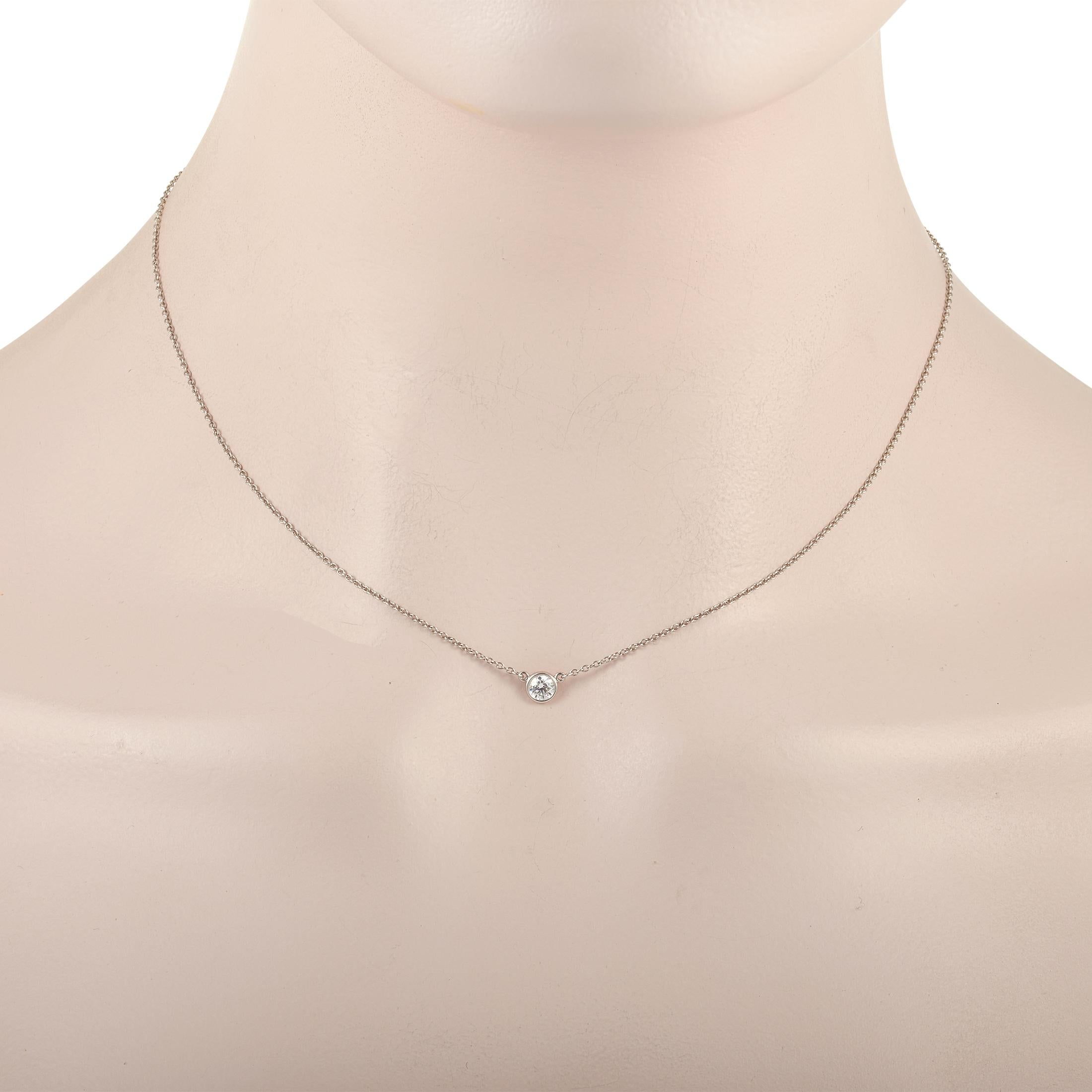 Polish any look with the dainty elegance of this Tiffany & Co. Platinum 0.25 ct Round Diamond by The Yard Solitaire Necklace. It is designed with a delicate cable chain necklace measuring 16 inches long and a single 0.25-carat bezel-set round