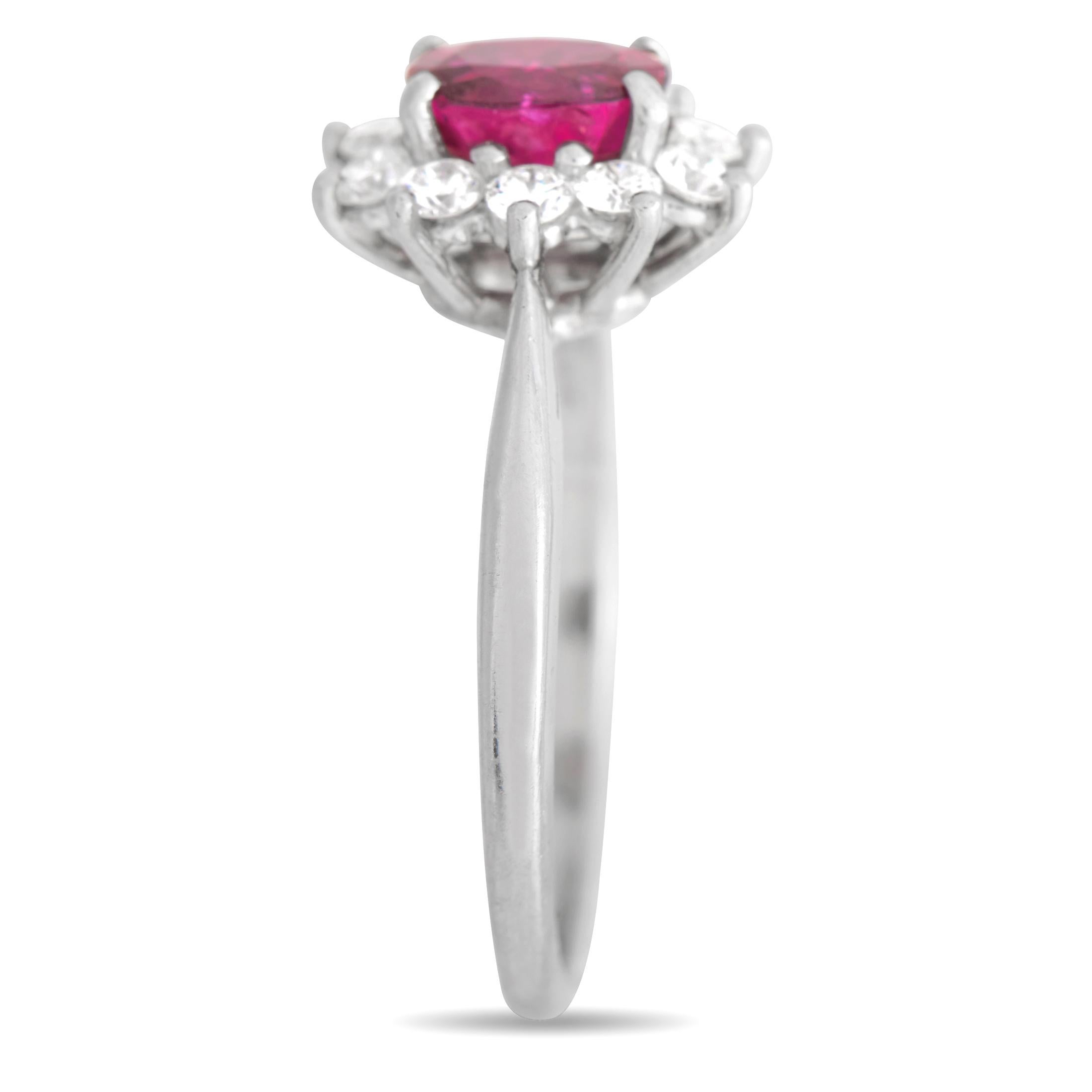 A breathtaking 0.75 carat ruby makes a statement at the center of this luxurious ring from Tiffany & Co. The surrounding halo of round-cut diamonds totaling 0.25 carats add extra sparkle to this classically elegant accessory. Crafted from shimmering