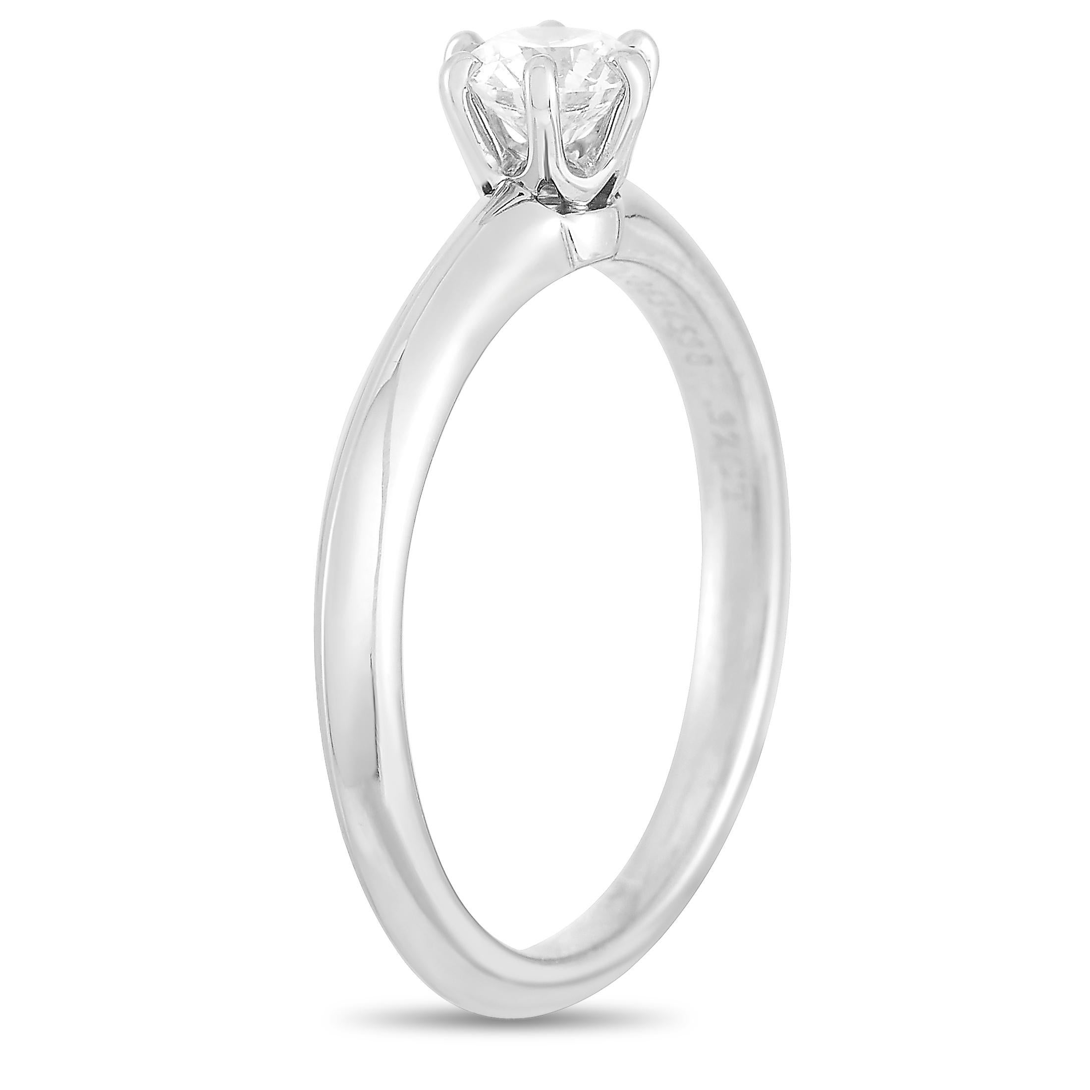 This Tiffany & Co. engagement ring is made of platinum and set with a 0.32 ct diamond stone that features est. G color and VS1 clarity. The ring weighs 3.2 grams and boasts band thickness of 2 mm and top height of 5 mm, while top dimensions measure