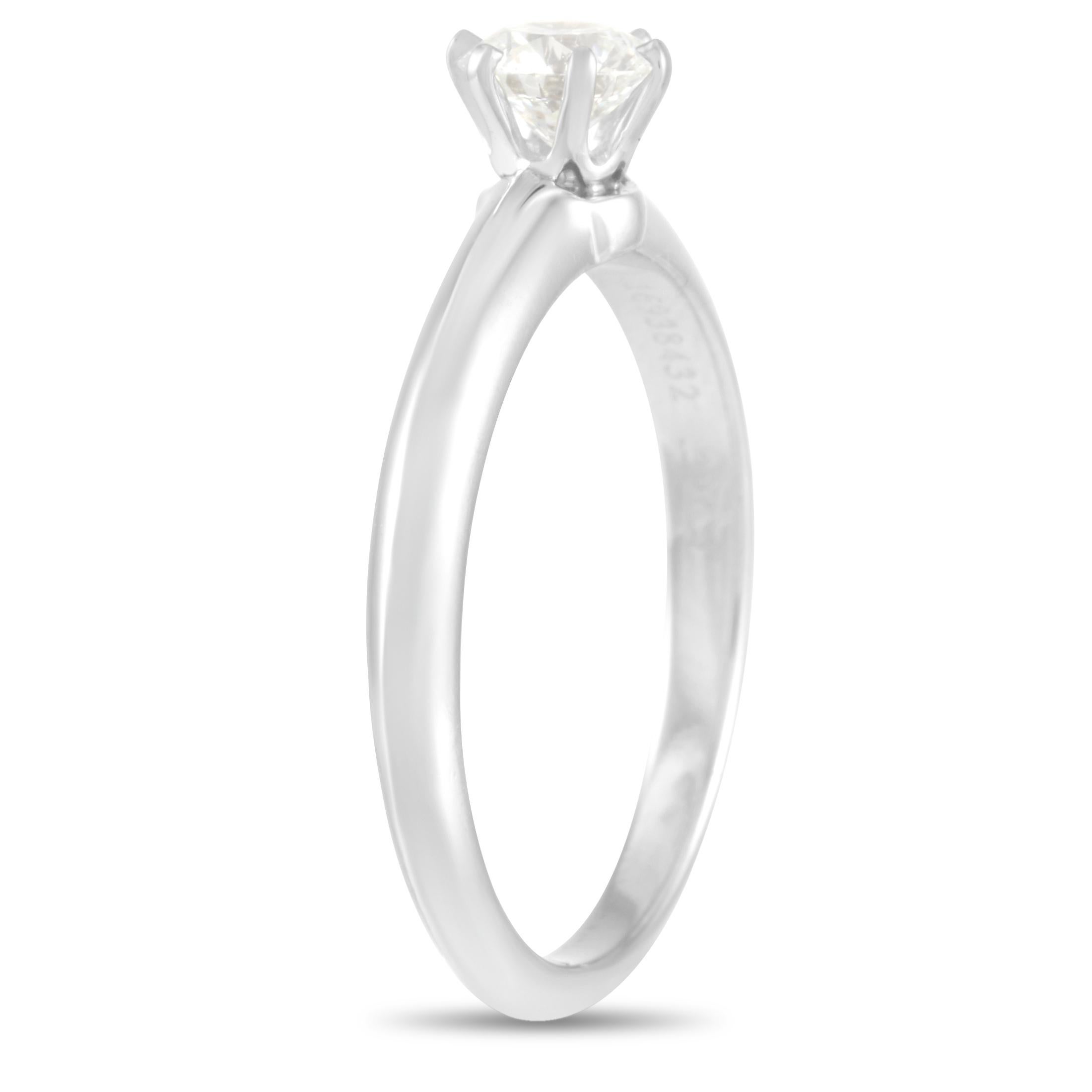 This Tiffany & Co. Platinum 0.39 ct  Diamond Solitaire Ring exudes stunning simplicity. Showcasing the design that started it all, this ring carries the classic look of an engagement ring as introduced by Tiffany in 1886. A round brilliant-cut