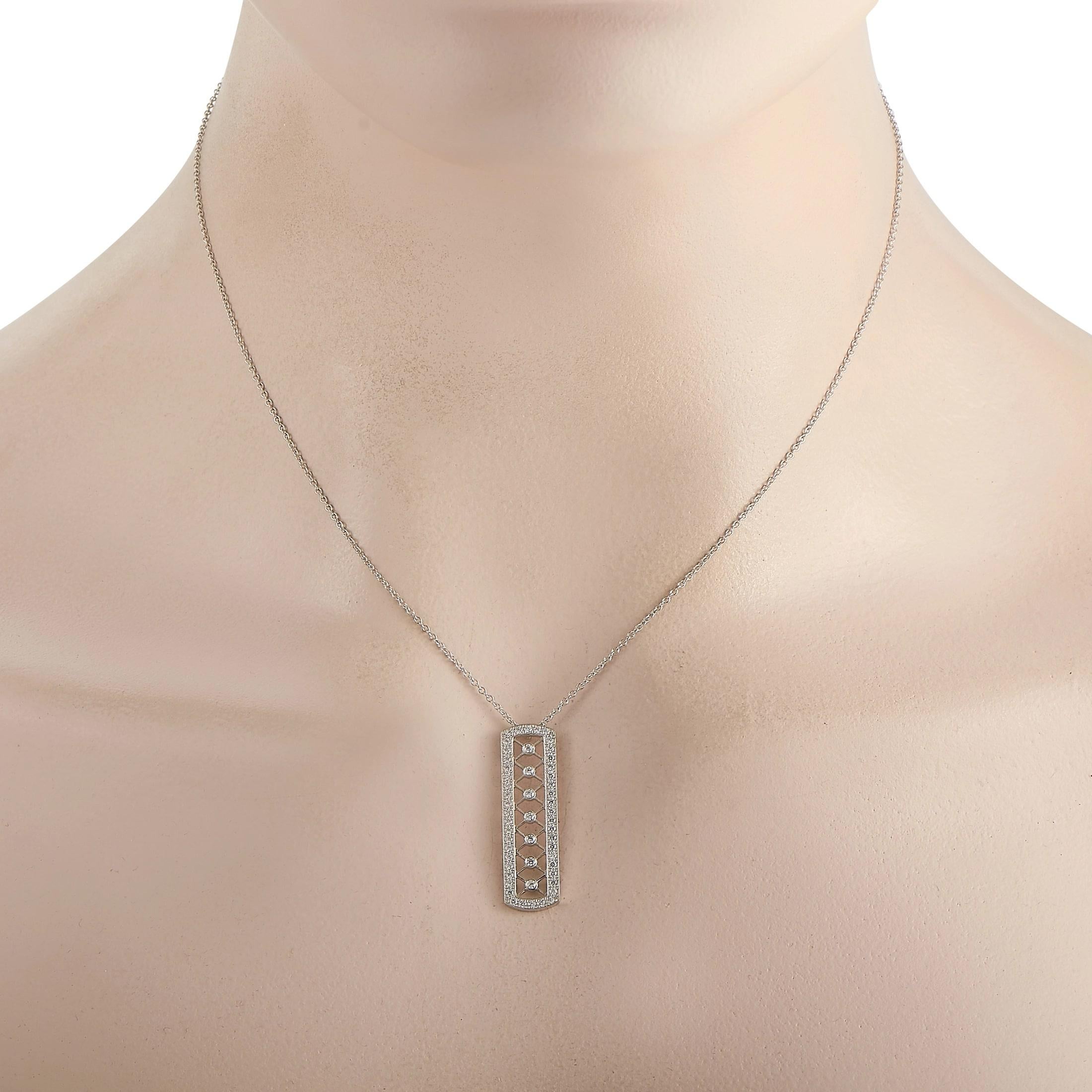 This diamond pendant necklace from Tiffany & Co. is decidedly delicate. On the elegant pendant - which measures 1.15” long and .31” wide - you’ll find an intricate Platinum lattice-shaped design that is accented by 0.40 carats of glittering
