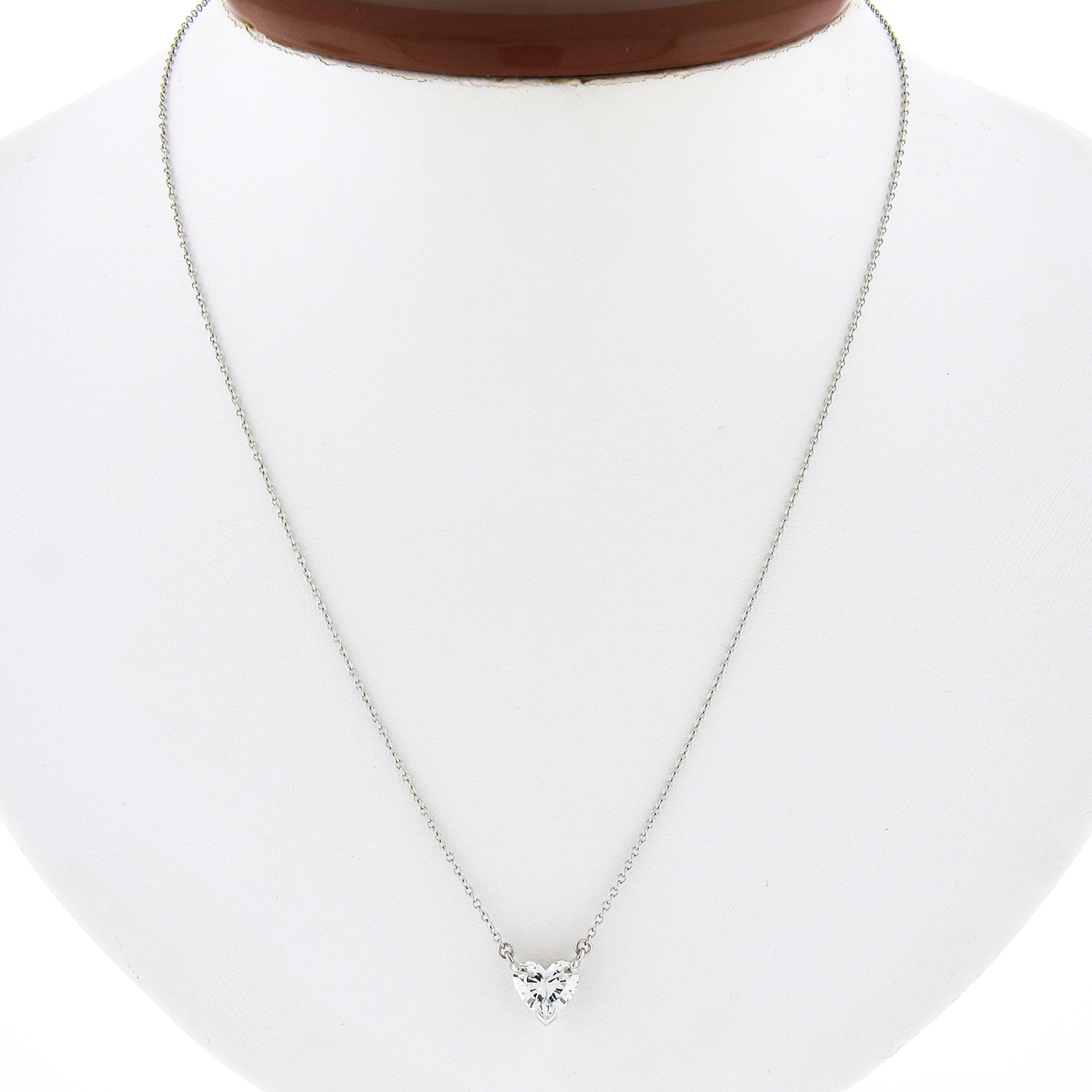 This classic and absolutely stunning heart diamond solitaire pendant by Tiffany & Co. is crafted in solid platinum and features brilliant heart cut diamond prong set at the simple and elegantly designed basket. This 1.08 carat diamond is pure FIRE!