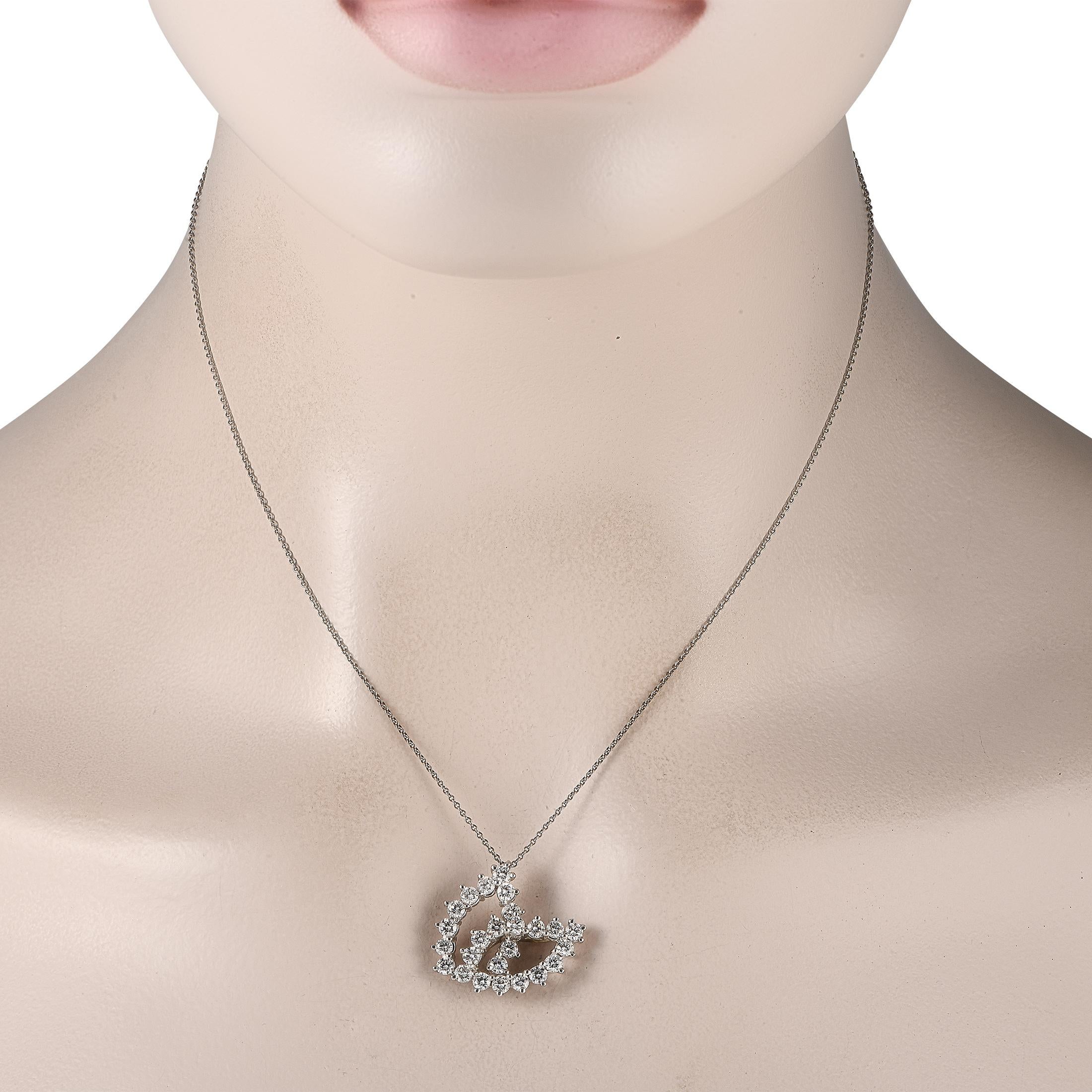 Sparkling Diamonds with a total weight of 1.50 carats elevate this simple, elegant Tiffany & Co. necklace. Suspended from a 16 chain, a Platinum pendant measuring 0.75 long by 0.85 makes a scintillating statement.This jewelry piece is offered in