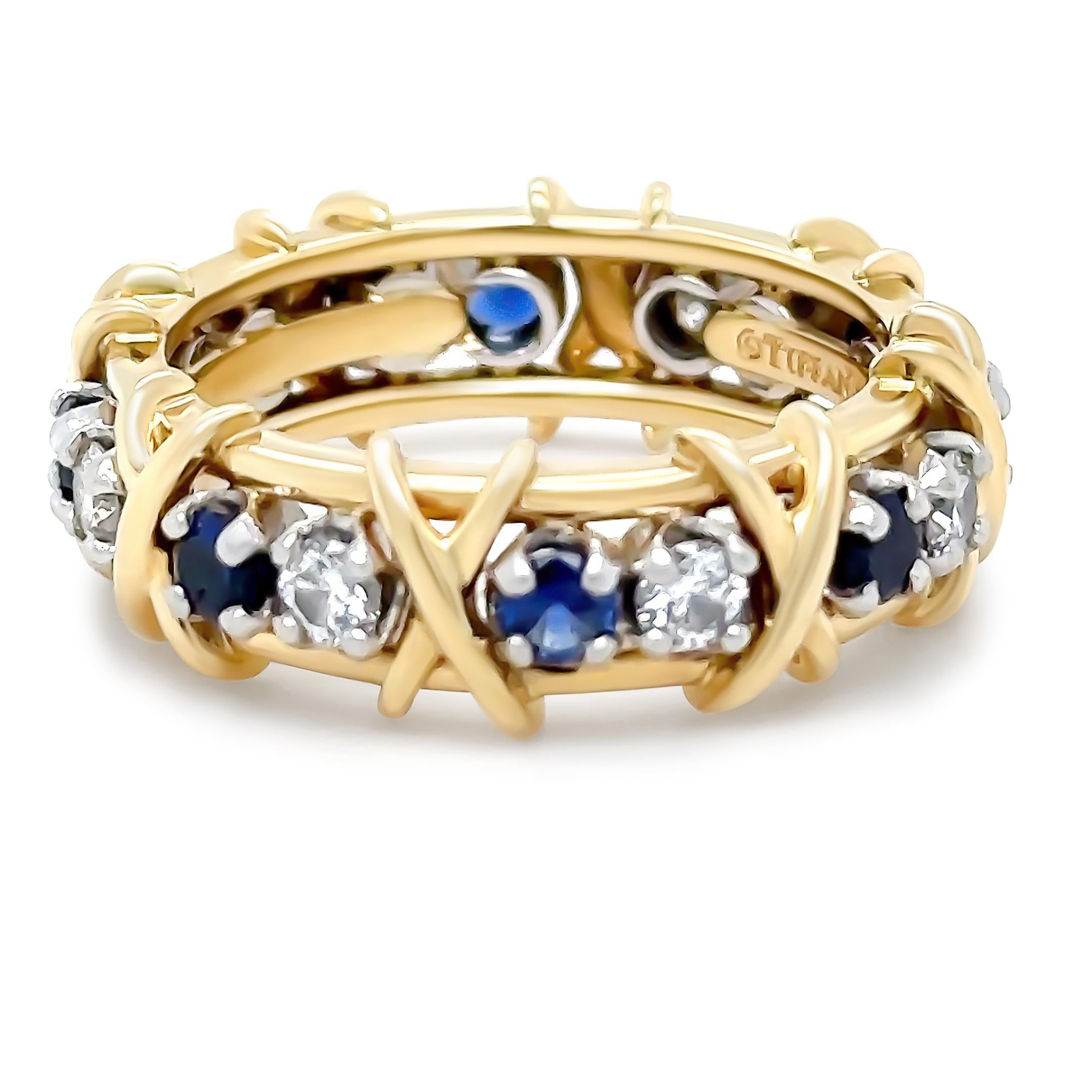 A Tiffany & Co Jean Schlumberger Sixteen Stone Ring, made of 950 Platinum and 18ct Yellow Gold. Featuring Round Brilliant Cut Diamonds weighing 0.59ct and Round Sapphires weighing 0.75ct. Total Carat weight of 1.34ct. 

Metal: Platinum PT950 & 18ct