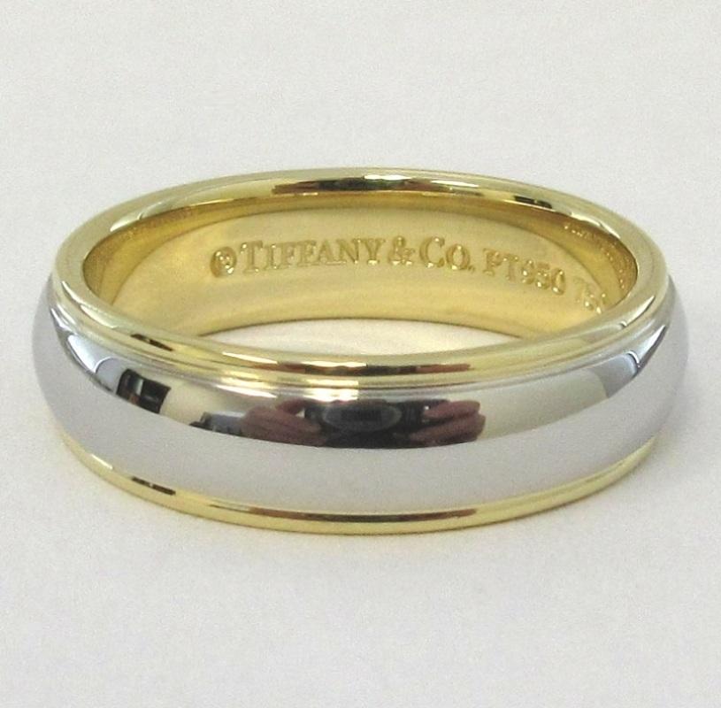 TIFFANY & Co. Platinum 18K Gold 6mm Lucida Wedding Band Ring 7.5

Metal: Platinum and 18K Yellow Gold
Size: 7.5
Band Width: 6mm
Weight: 10.0 grams
Hallmark: ©TIFFANY&CO. PT950 750
Condition: Excellent condition, like new

Limited edition, no longer
