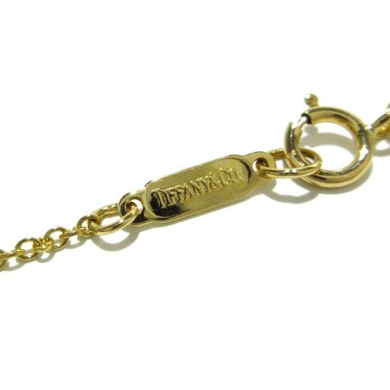 TIFFANY & Co. Collier croix cruciforme en platine, or 18K et diamants Pour femmes en vente