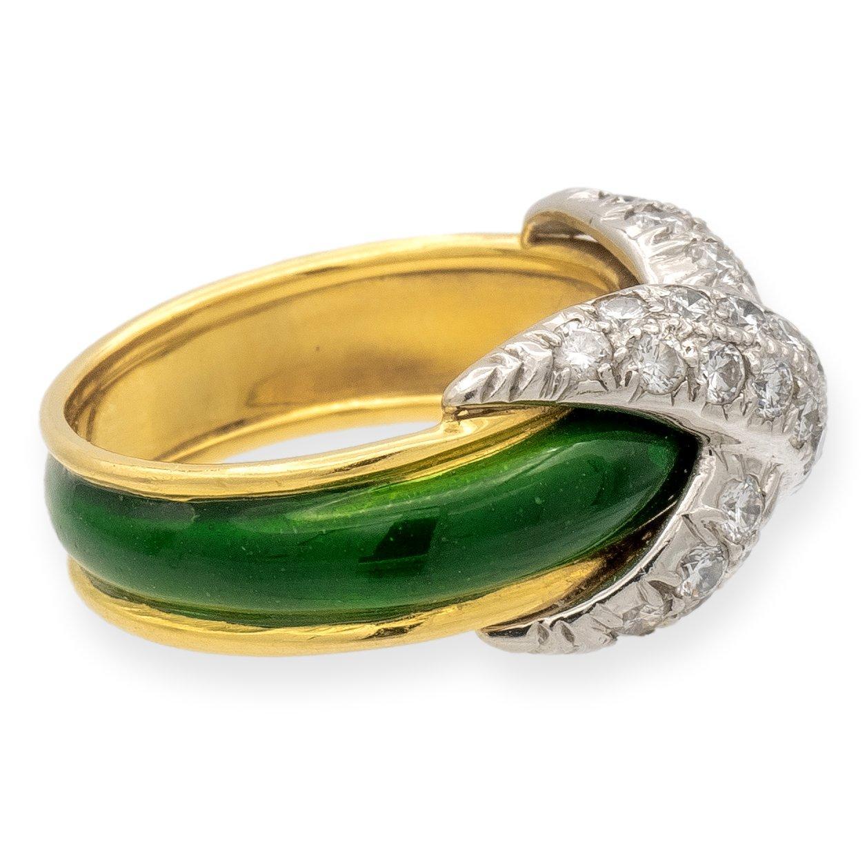 Tiffany & Co. Schlumberger Collection ring, finely crafted in 18-karat yellow gold in a tapered design, adorned with vivid green enamel, culminating in an X motif center in platinum. The platinum setting is embellished with round brilliant cut