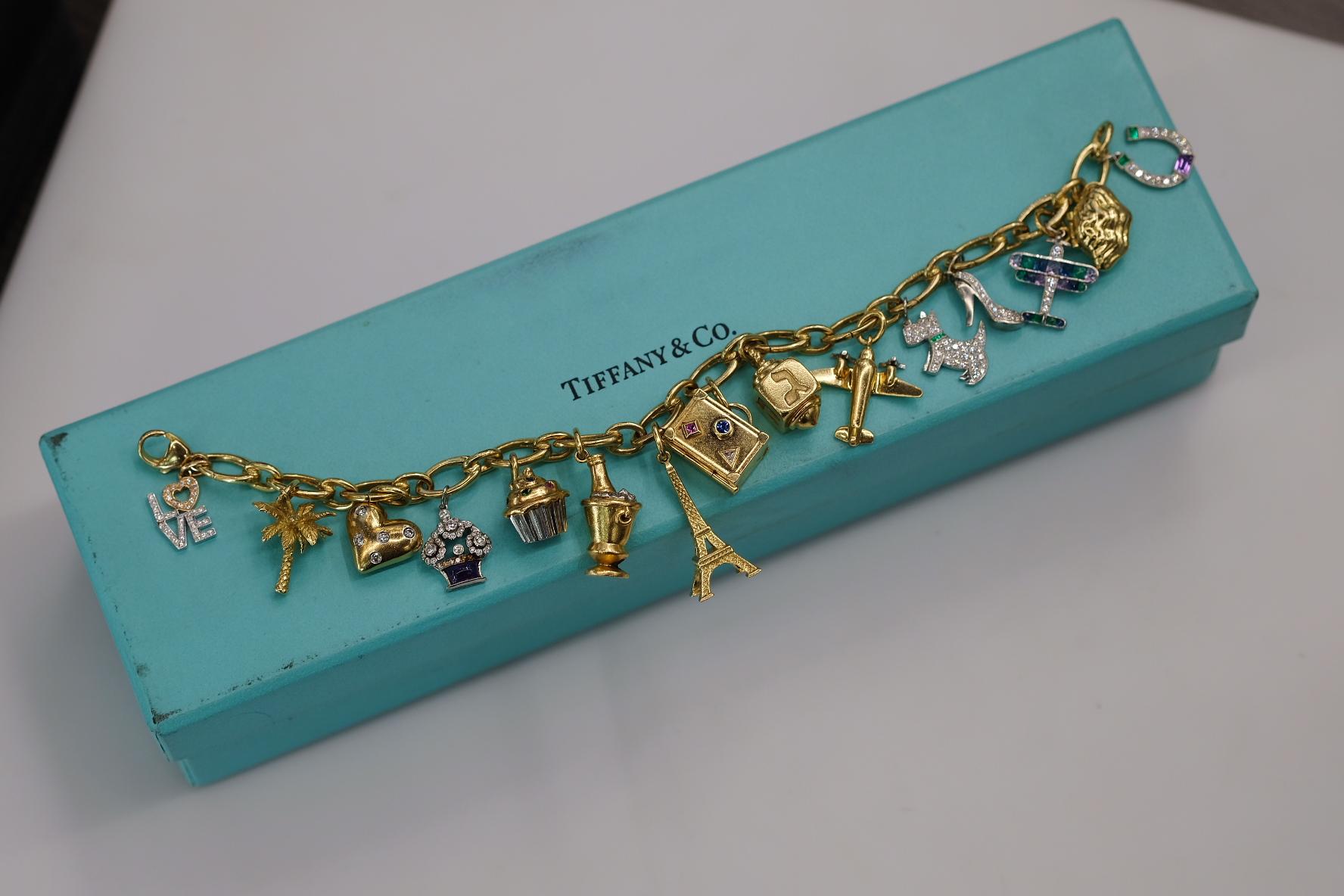 Tiffany & Co. Platinum & 18K Yellow Gold Gemset And Diamond Charm Bracelet In Excellent Condition For Sale In New York, NY