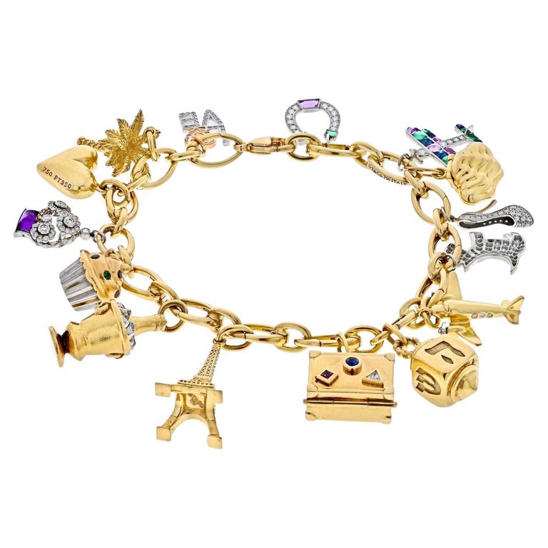 Tiffany and Co. Platinum and 18K Yellow Gold Gemset And Diamond Charm  Bracelet For Sale at 1stDibs