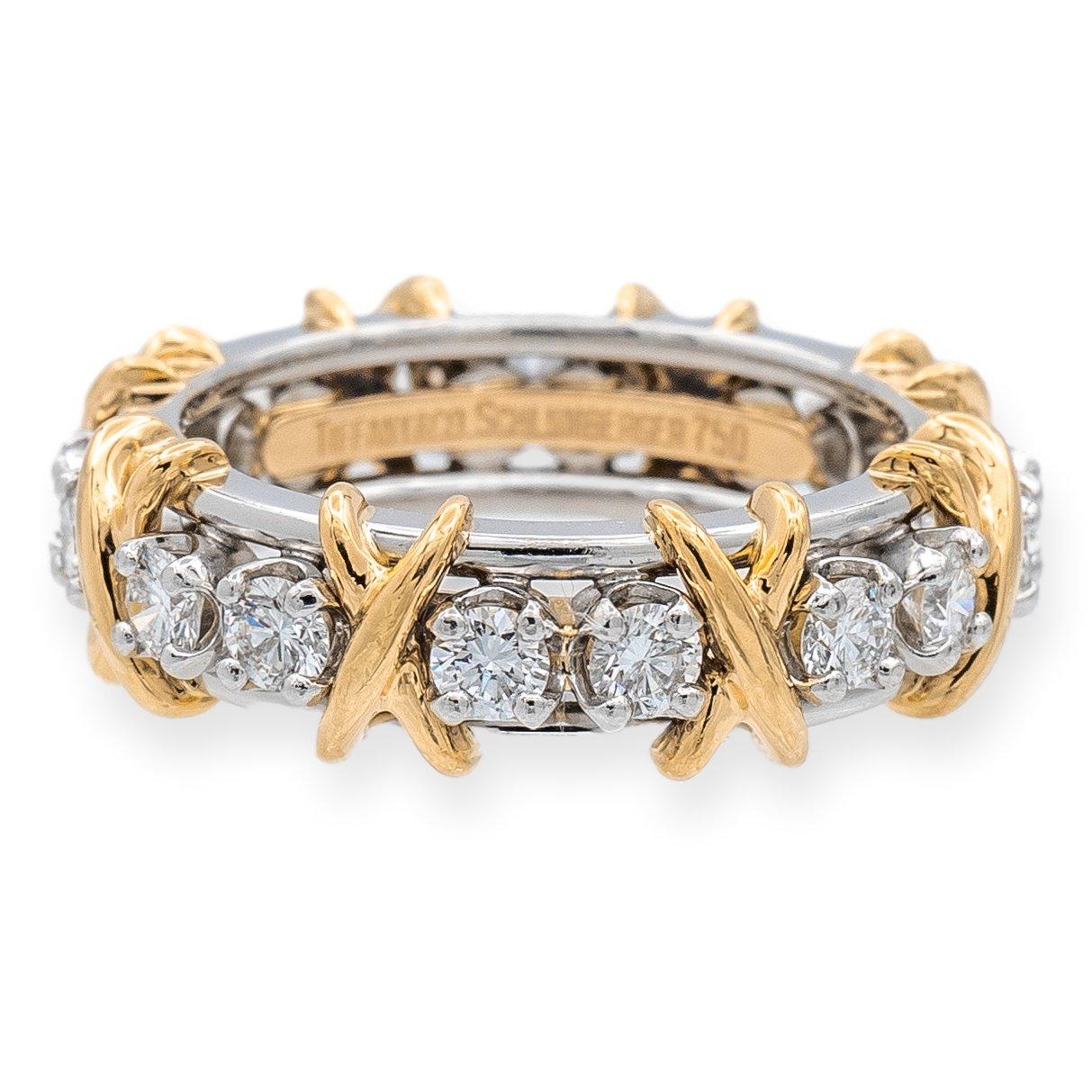Tiffany & Co. band ring designed by Jean Schlumberger finely crafted Platinum and 18 Karat yellow gold featuring 16 round brilliant cut diamonds weighing 1.18 carats total weight approximately in D-G color range and very fine VVS-VS clarity. Fully