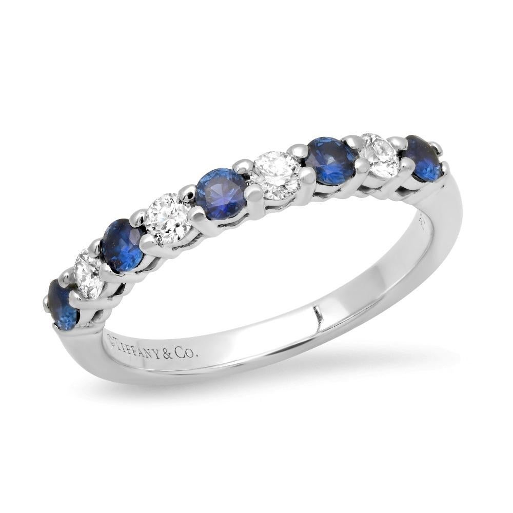 TIFFANY & Co. Platinum 2.2mm Half Circle Diamond Sapphire Embrace Band Ring 3

Metal: Platinum
Size: 3
Band Width: 2.2mm
Diamond: 4 round brilliant diamonds, carat total weight .12
Sapphire: 5 round blue sapphires, carat total weight .17 
Hallmark: