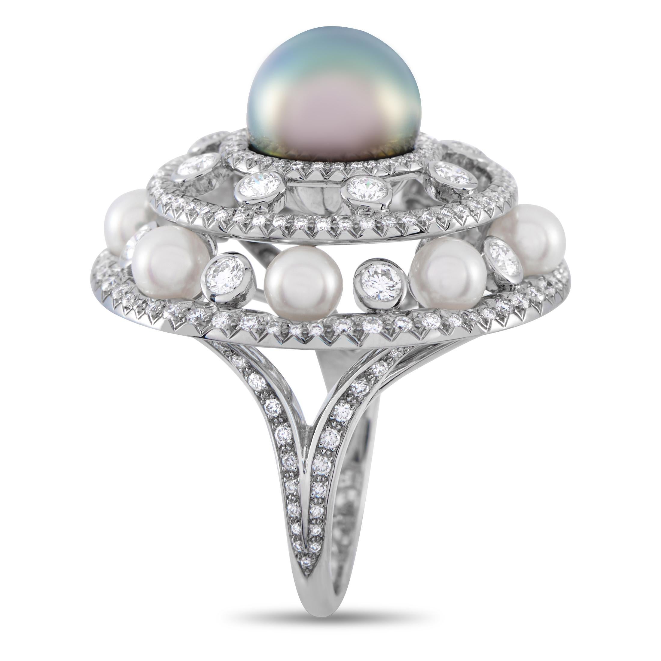 A Tiffany & Co. platinum ring that's sure to take your breath away. This stunning piece features a slender 3mm band with diamond-studded split shoulders supporting a glamorous tiered centerpiece. Top and center is a lustrous pearl nestled on layered