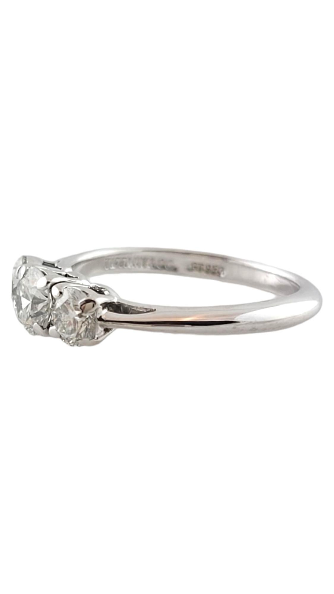 Tiffany & Co. Platinum 3 Round Brilliant Diamond Engagement Ring .75cts

This beautiful platinum diamond engagement ring is set with 3 round brilliant diamonds.

Center diamond is .35cts  VS1 clarity, H color

Two sides diamonds are .20cts each VS1