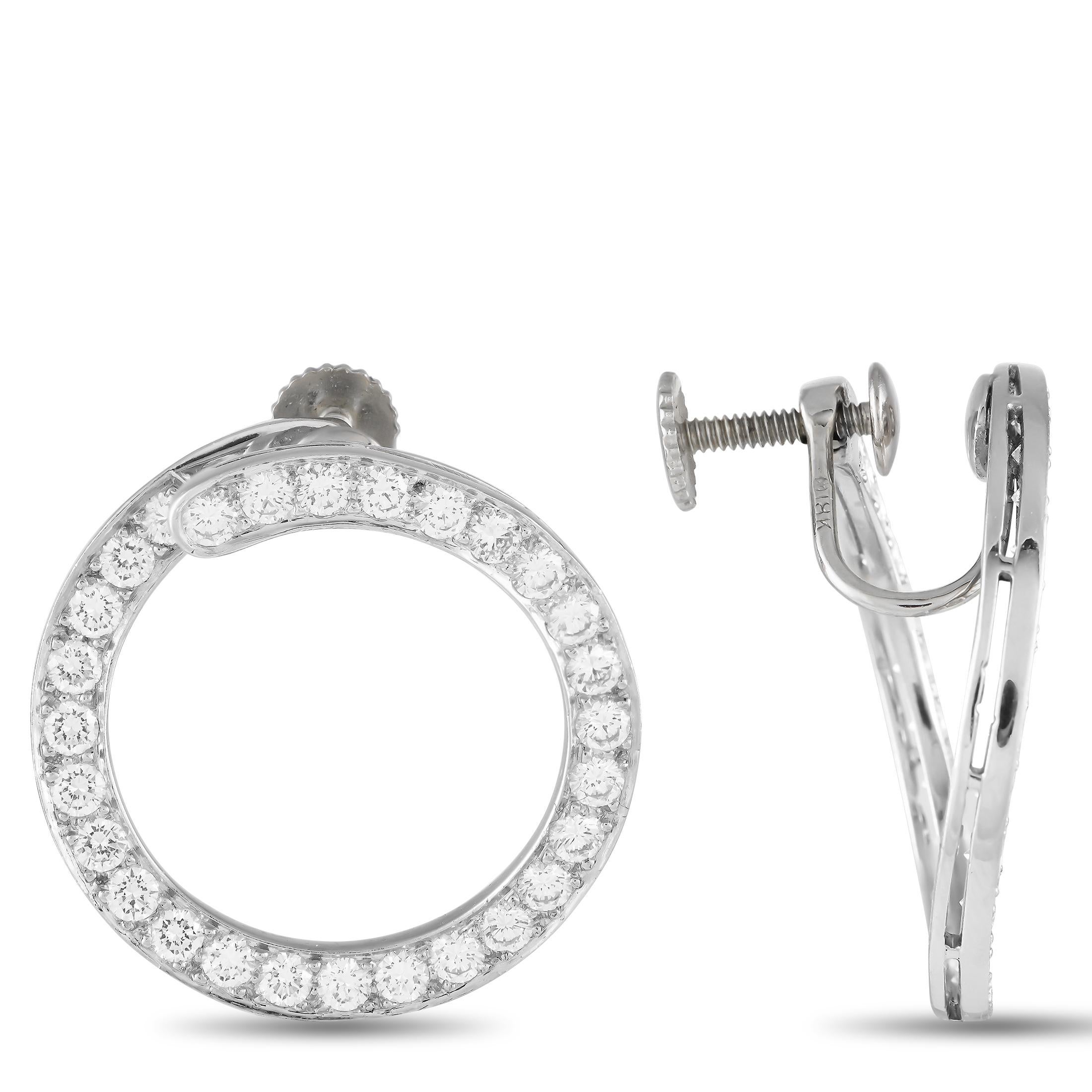 These earrings are the perfect special occasion hoops. They feature a unique front-to-back design where the circular shape faces forward instead of the usual hoops that hang sideways. A flurry of diamonds traces each platinum hoop, delivering a