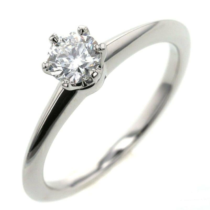 TIFFANY & Co. Platinum .37ct Diamond Engagement Ring 5.5

Metal: Platinum
Size: 5.5
Diamond: Round brilliant diamond, carat total weight .37ct, H color, VS1 clarity
Hallmark: ©TIFFANY&Co. Pt950   69413552  D0.37ct
Condition: Excellent condition,