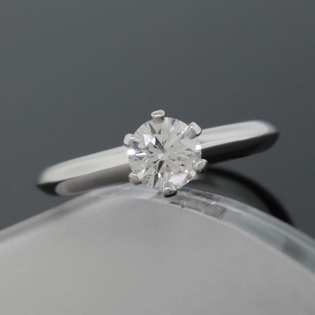 TIFFANY & Co. Platinum .48ct Diamond Engagement Ring 6

Metal: Platinum
Size: 6
Diamond: round brilliant cut diamond, carat total weight .48ct, G color, VS1 clarity
Hallmark: ©TIFFANY&Co. PT950  62410442  D0.48CT
Condition: Excellent condition, like