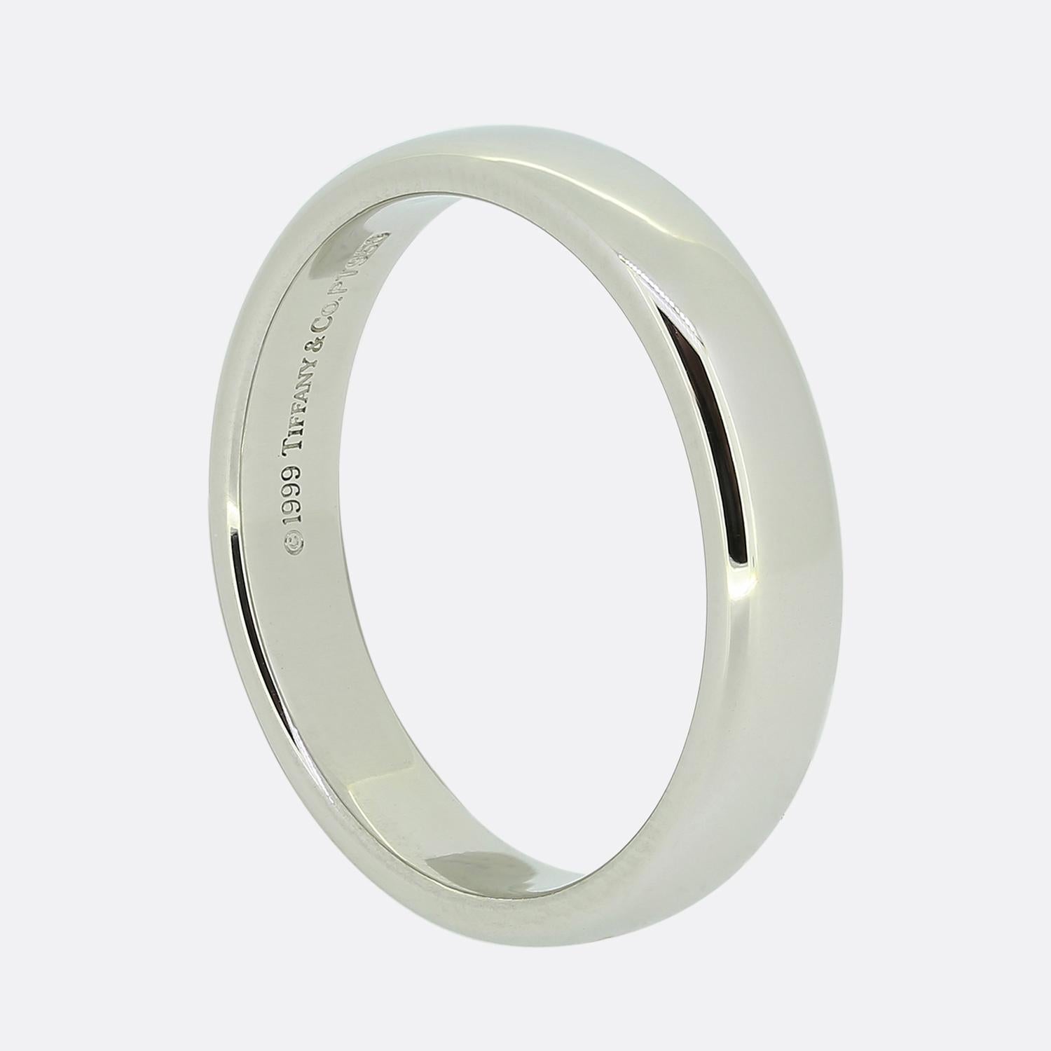 Here we have a classic plain polished wedding band ring from the world renowned jewellery designer, Tiffany & Co. This timeless piece has been crafted from platinum, is 4mm in width and is perfect for both men and women.

Condition: Used