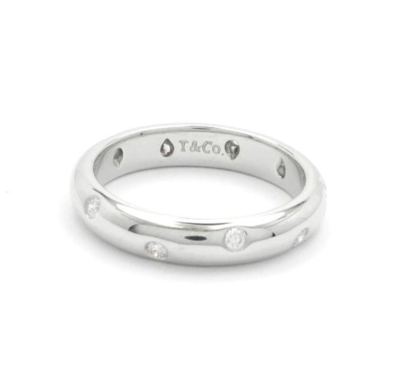 TIFFANY & Co. Platinum Diamond Etoile 4mm Band Ring 6

 Metal: Platinum
 Size: 6 
 Band Width: 4mm
 Weight: 7.50 grams 
 Diamond: 10 round brilliant diamonds, carat total weight .22
 Hallmark: T&Co. PT950
 Condition: Excellent condition, like new,