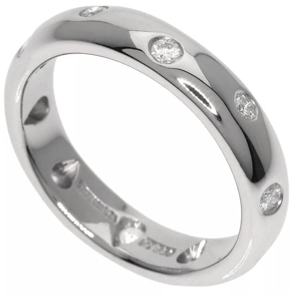 TIFFANY & Co. Etoile Platinum Diamond 4mm Band Ring 6

 Metal: Platinum
 Size: 6 
 Band Width: 4mm
 Weight: 8.20 grams 
 Diamond: 10 round brilliant diamonds, carat total weight .22
 Hallmark: TIFFANY&Co. PT950
 Condition: Excellent condition, like