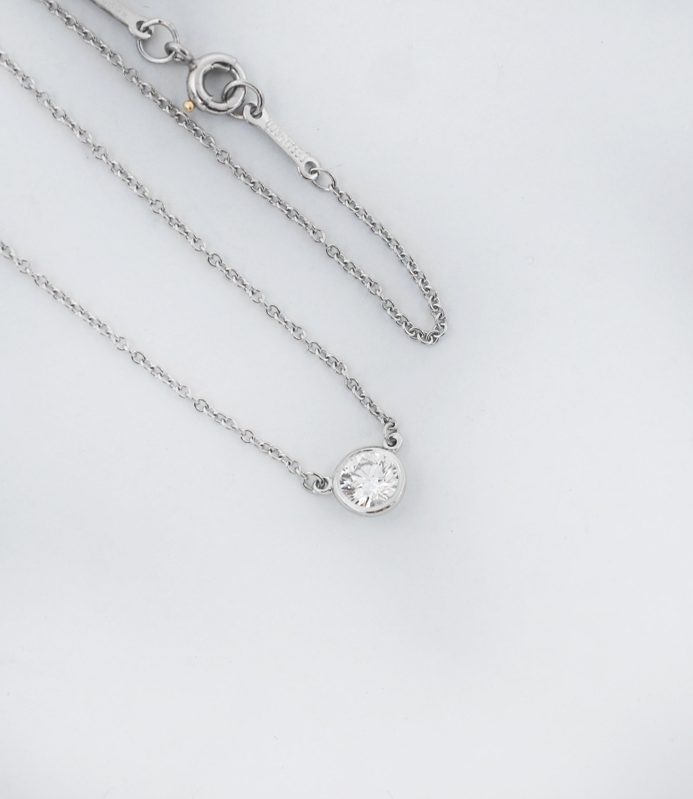 A single hand-polished diamond shines at the center of this delicate and refined platinum pendant. Elsa Peretti’s revolutionary Diamonds by the Yard collection features a combination of fine, fluid chains and bezel-set stones that forever changed