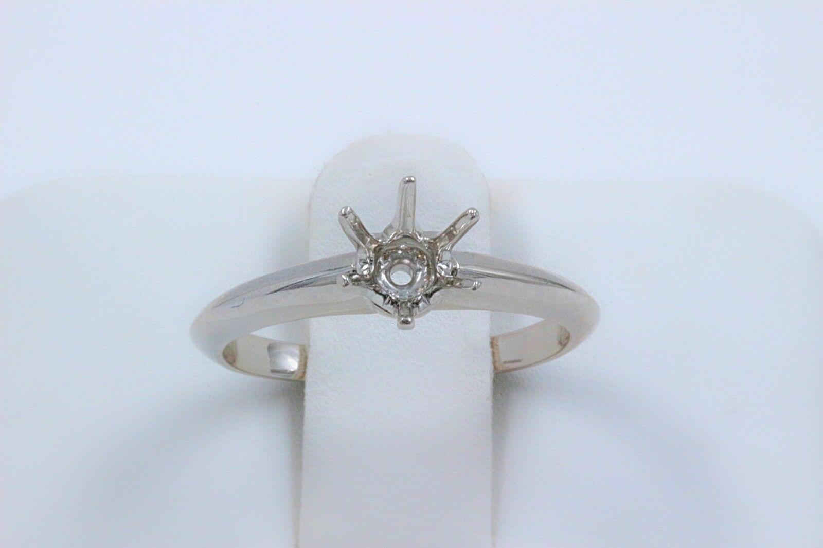 Tiffany & Co Solitaire Semi-Mount
Style:  Six - Prong Solitaire Setting
Metal:  Platinum  PT950
Size:  6 - sizable
Center:  This setting will fit a Round Stone between 0.7 cts - 1 cts
Hallmark:  TIFFANY&CO.PT950 D29909 .76 CT
Includes:  T&C POUCH