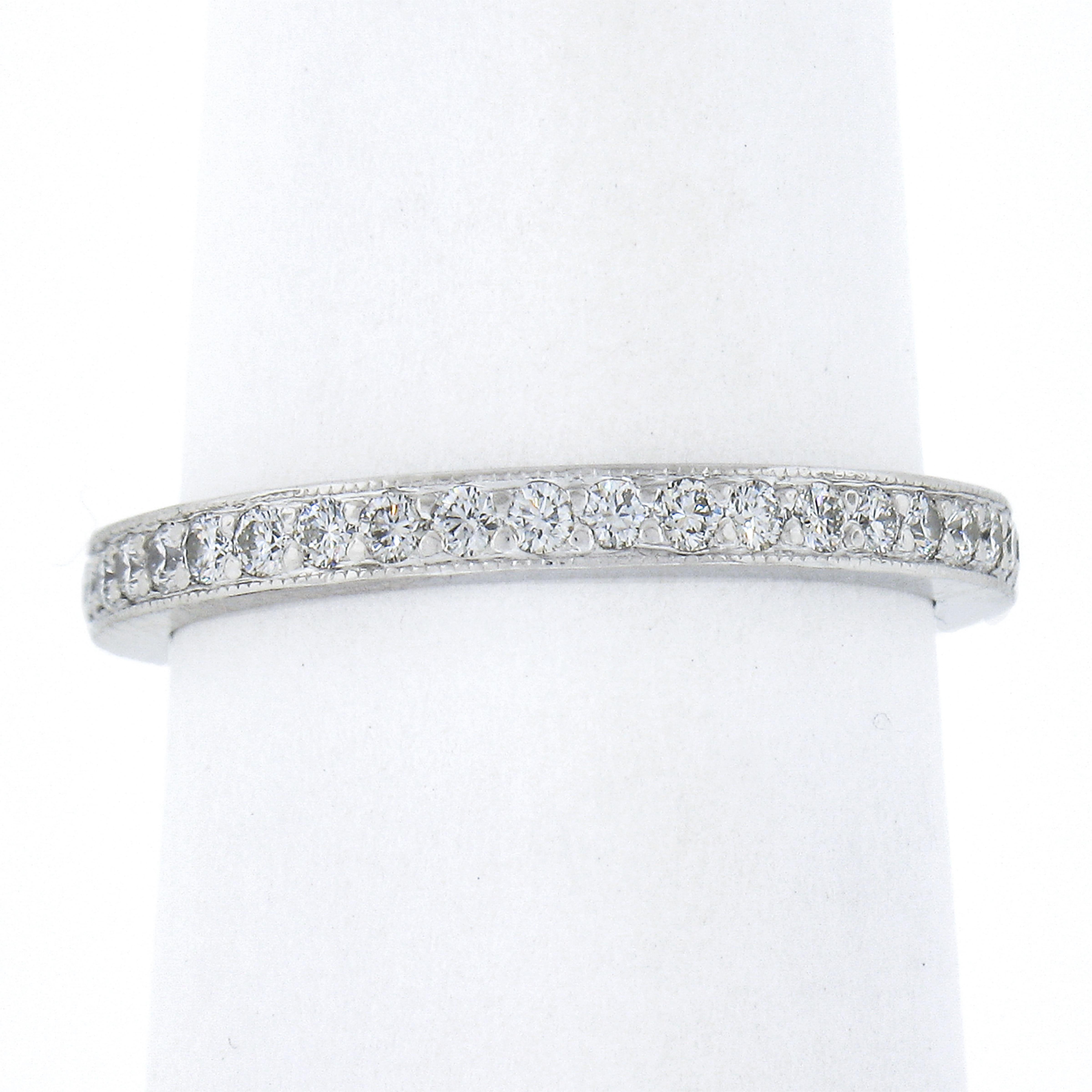 This stunning eternity band ring by Tiffany & Co. is crafted in solid platinum and features 40 high quality diamond stones which are neatly pave set throughout the entire band. This classic and well made eternity ring looks incredibly glamorous