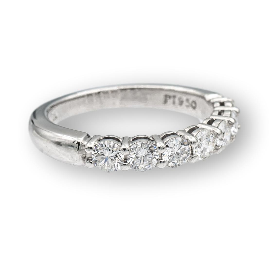 Tiffany & Co. Embrace Half Band ring finely crafted in platinum with 7 Round Brilliant cut diamonds weighing .57 carats total weight. Very bright E-F color , VVS2-VS clarity

RING SPECIFICATIONS
Brand: Tiffany & Co.
Hallmarks: Tiffany & Co. PT950
7