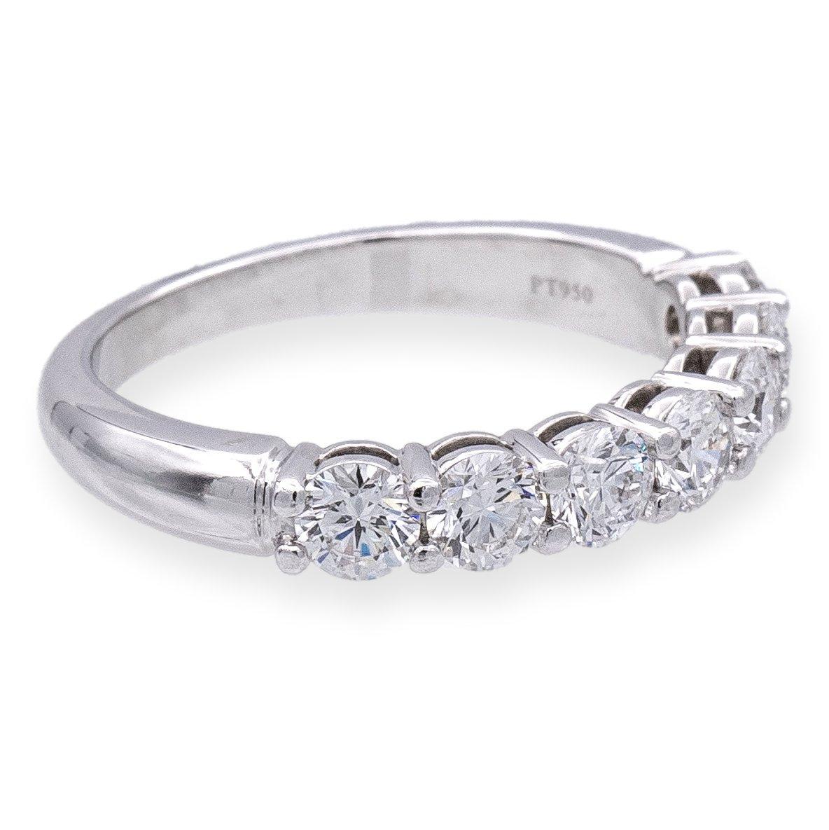 Tiffany & Co. Forever Half Band Ring, Meticulously crafted in platinum, this exquisite piece boasts seven Round Brilliant cut diamonds, collectively weighing 0.91 carats. Dazzling in E-F color and VVS2-VS clarity, each diamond is set in shared