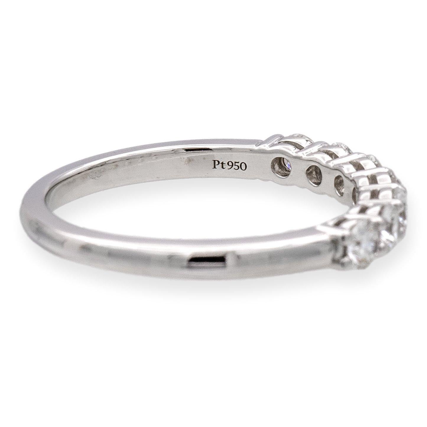 Tiffany & Co. Forever Half Band ring finely crafted in platinum featuring 7 Round Brilliant cut diamonds set in shared prongs weighing .57 carats total weight. Very bright E-F color , VVS2-VS clarity. The diamonds have excellent brilliance and fire.