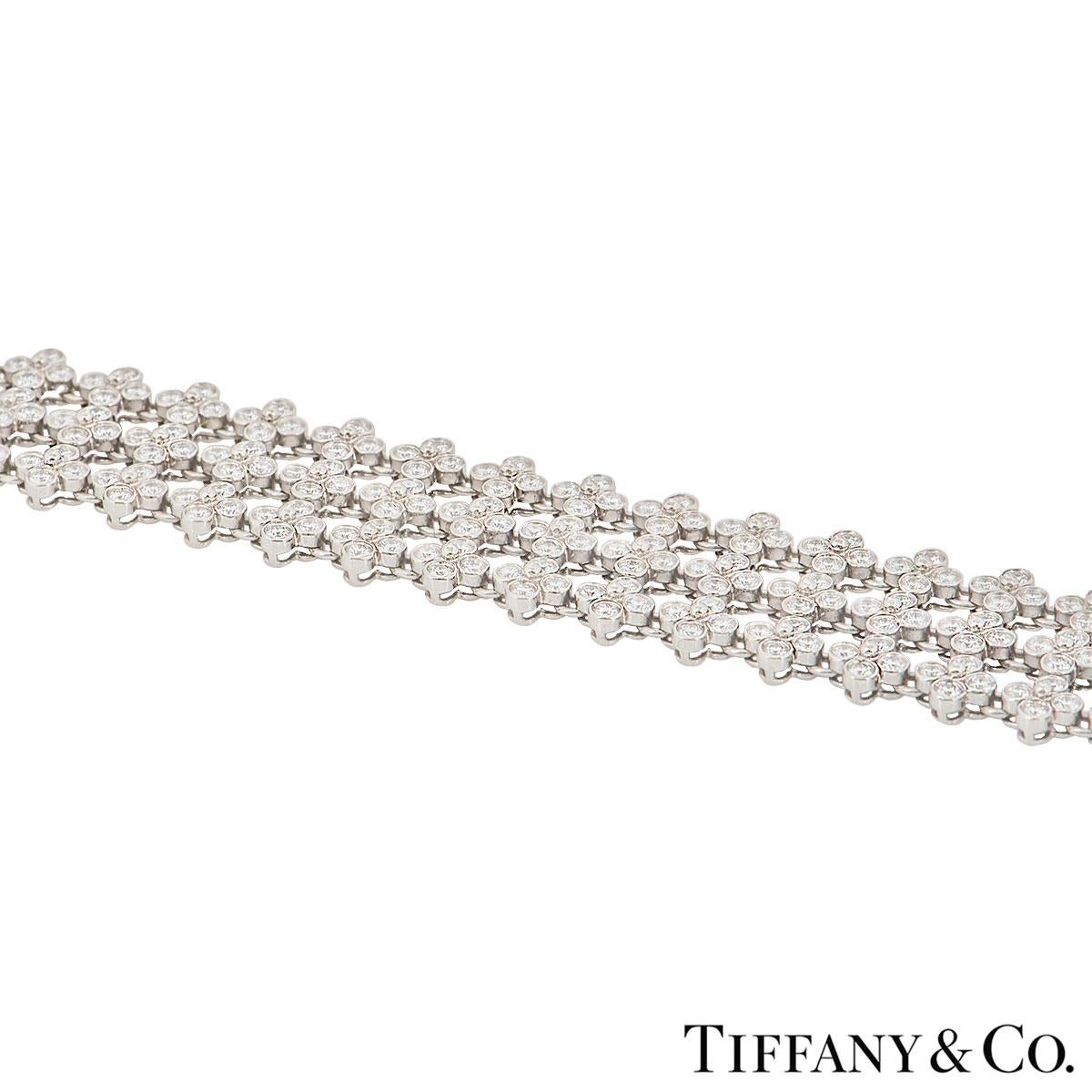 A beautiful bracelet by Tiffany & Co. from the Lace collection. The bracelet features 3 rows of floral motifs, with a total of 336 round brilliant cut diamonds in a rubover setting. The diamond have a total weight of approximately 7.00ct. The