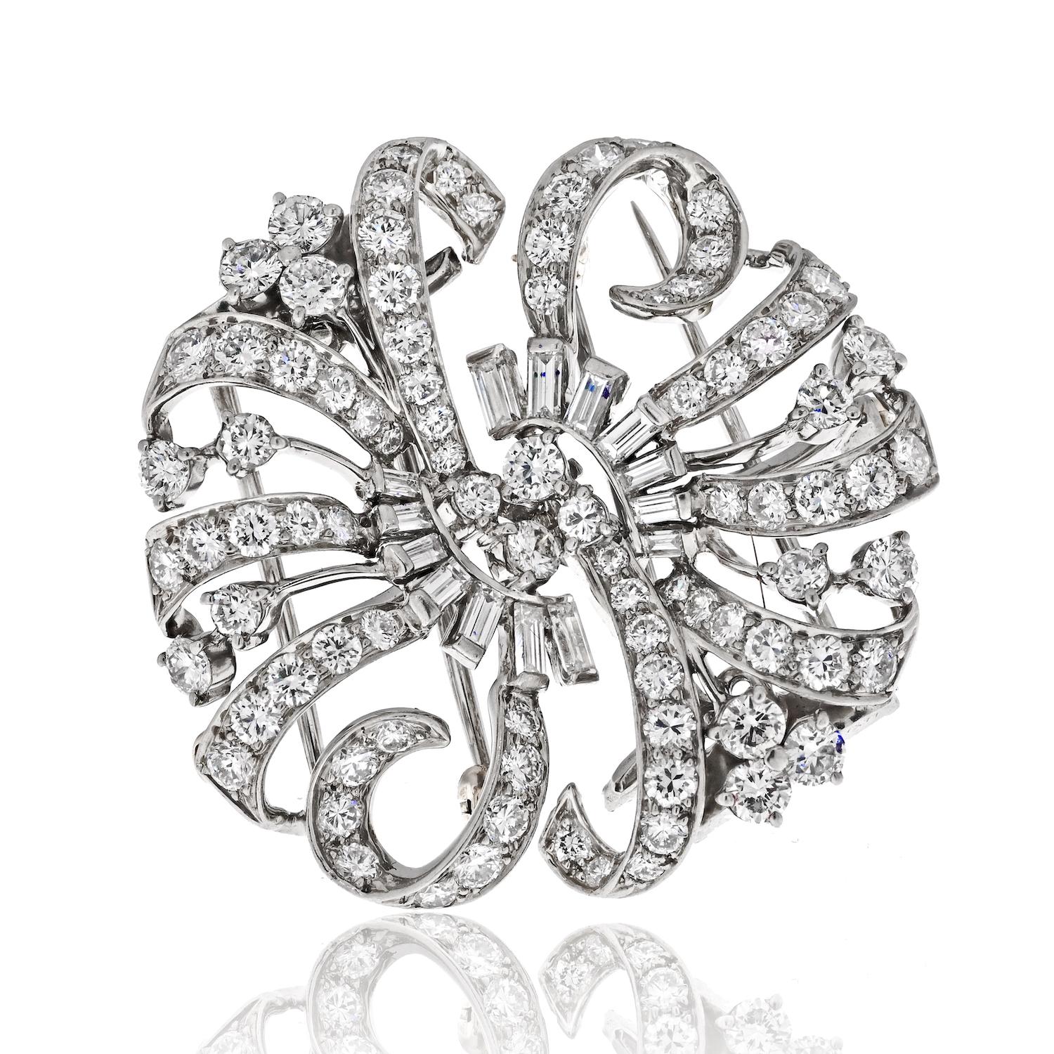Prepare to be enchanted by the sheer elegance and versatility of this Tiffany & Co. diamond brooch. Crafted in exquisite platinum, this remarkable piece showcases a stunning display of round and baguette diamonds, totaling an impressive