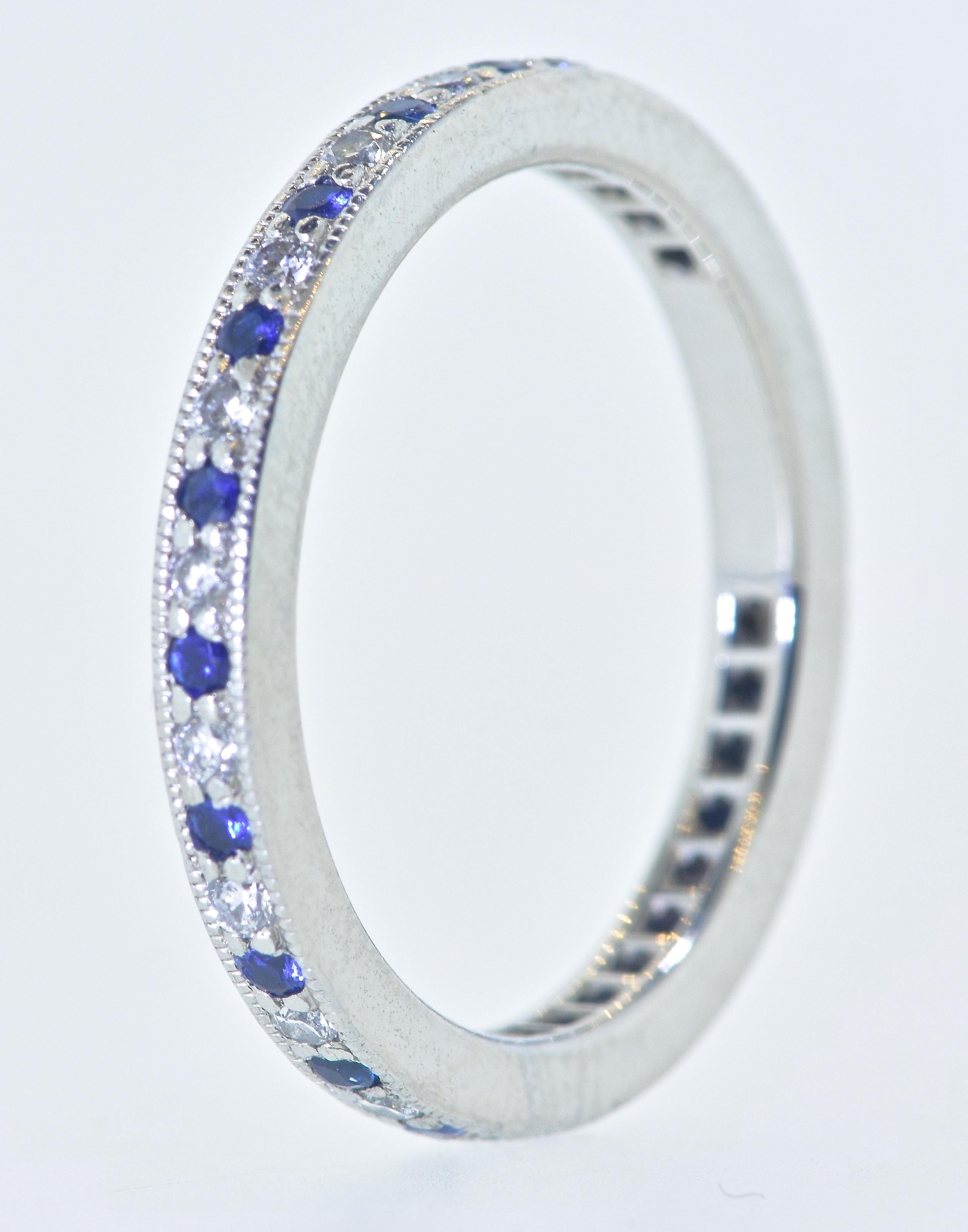 Tiffany & Co. diamond and sapphire platinum band. This eternity band from Tiffany's Legacy Collection is well made as one would expect from the world famous house of Tiffany & Co.  The diamonds and the sapphires are set in milgrained edges.  This