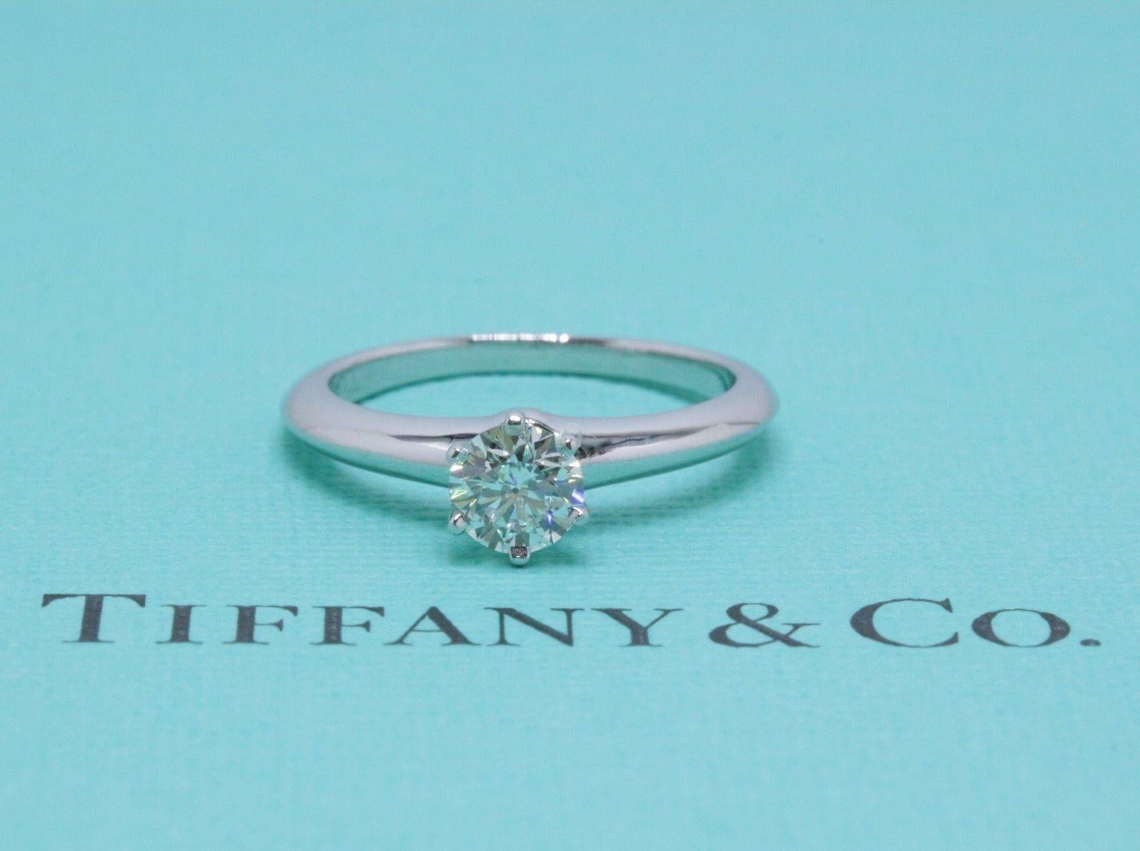 Tiffany & Co.
Style:  Tiffany 6-Prong  Classic Solitaire
Serial Number:  27658237/L10180268
Metal:  Platinum PT950
Ring Size:  6.5 - Sizable
Total Carat Weight: 0.58 TCW
Diamond Shape:  Round Brilliant Diamond 0.58 CTS 
Color & Clarity: I /