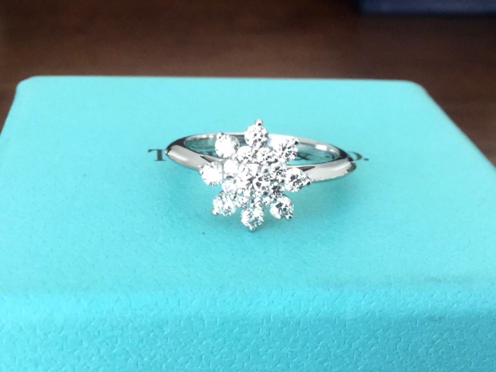 For your consideration is a Tiffany & Co Platinum and Diamond .60 carat Flower Ring.  This ring makes the perfect cocktail ring or engagement ring.  This Tiffany & Co ring sold for $4,900 plus $346 in tax for a total of $5,246 in 2014. This Ring is