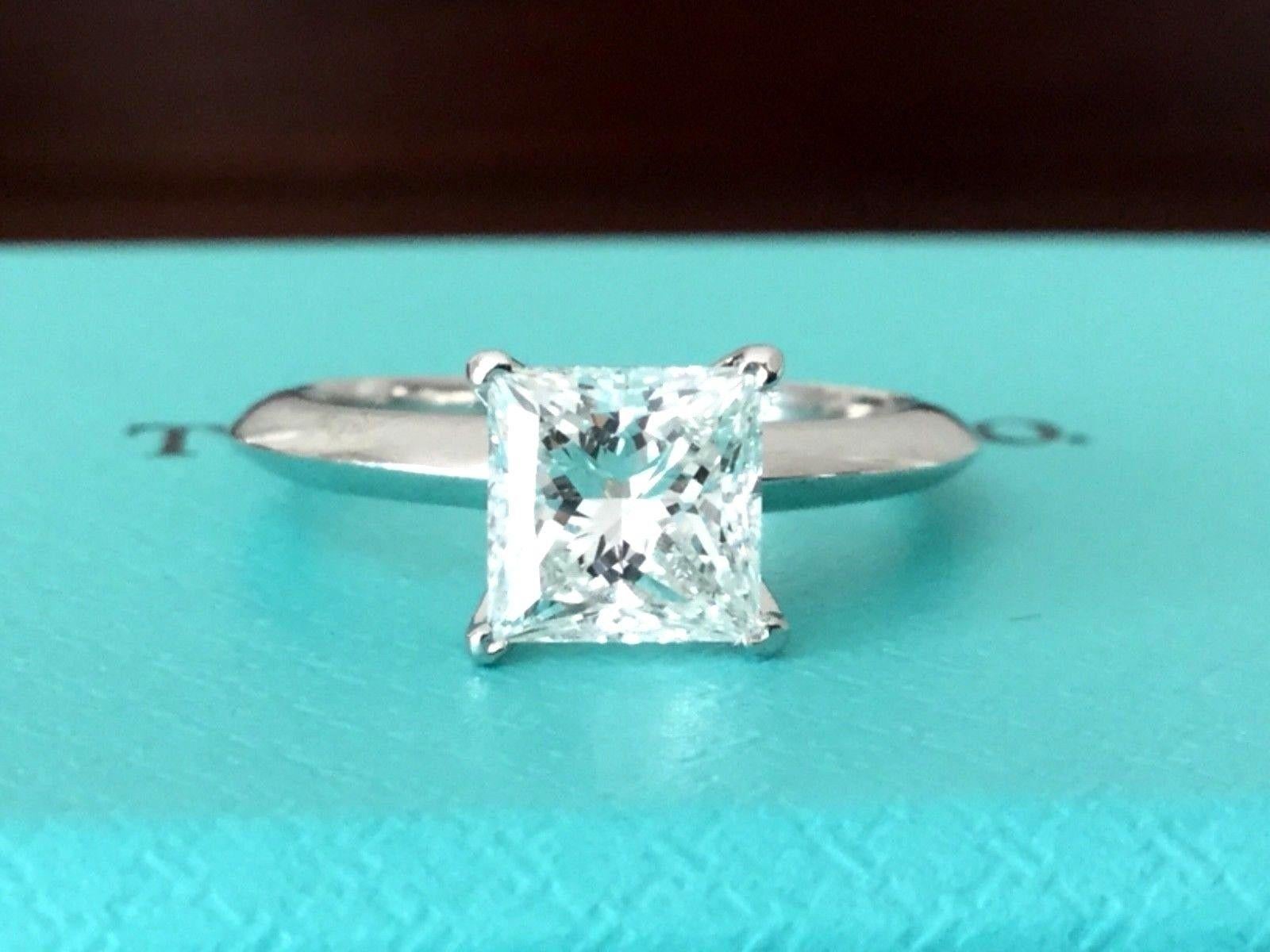 For your consideration is a Tiffany & Co Princess cut, natural diamond solitaire that is 1.07 carats, F in Color and VS1 in Clarity and EXCELLENT cut and polish and very good symmetry making it a very rare and desirable diamond.  It is set in the