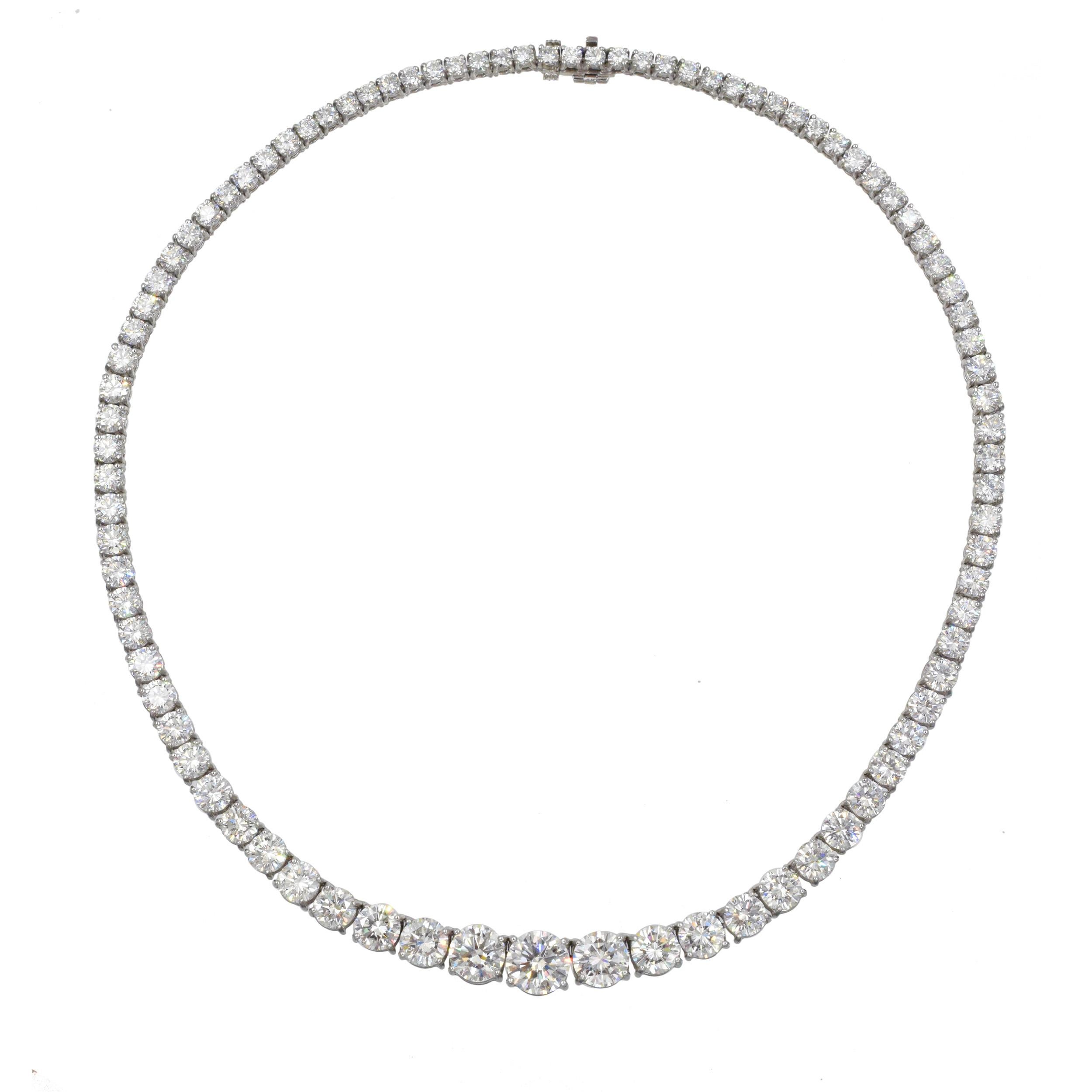 Tiffany & Co Platinum and Diamond Riviera Necklace This necklace has a round
diamond center weighing 2.26 cts., 2 round diamonds flanking center weighing a total of 2.92 cts., 86 round diamonds weighing 24.43 cts. (Color: F-H, VS) all set in