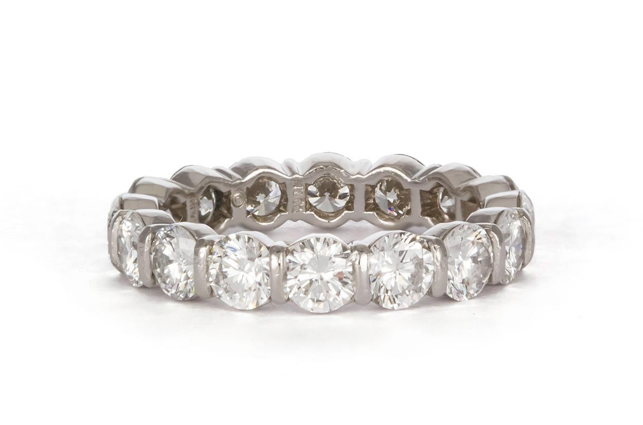 We are pleased to offer this Authentic Tiffany & Co. Platinum & Diamond Tiffany Embrace Band Ring. It features 1.86ctw F-G/VVS-VS Round brilliant Cut Diamonds set in .950 Platinum. It is a size 5.25 US and measures 3.7mm wide. The ring is in very
