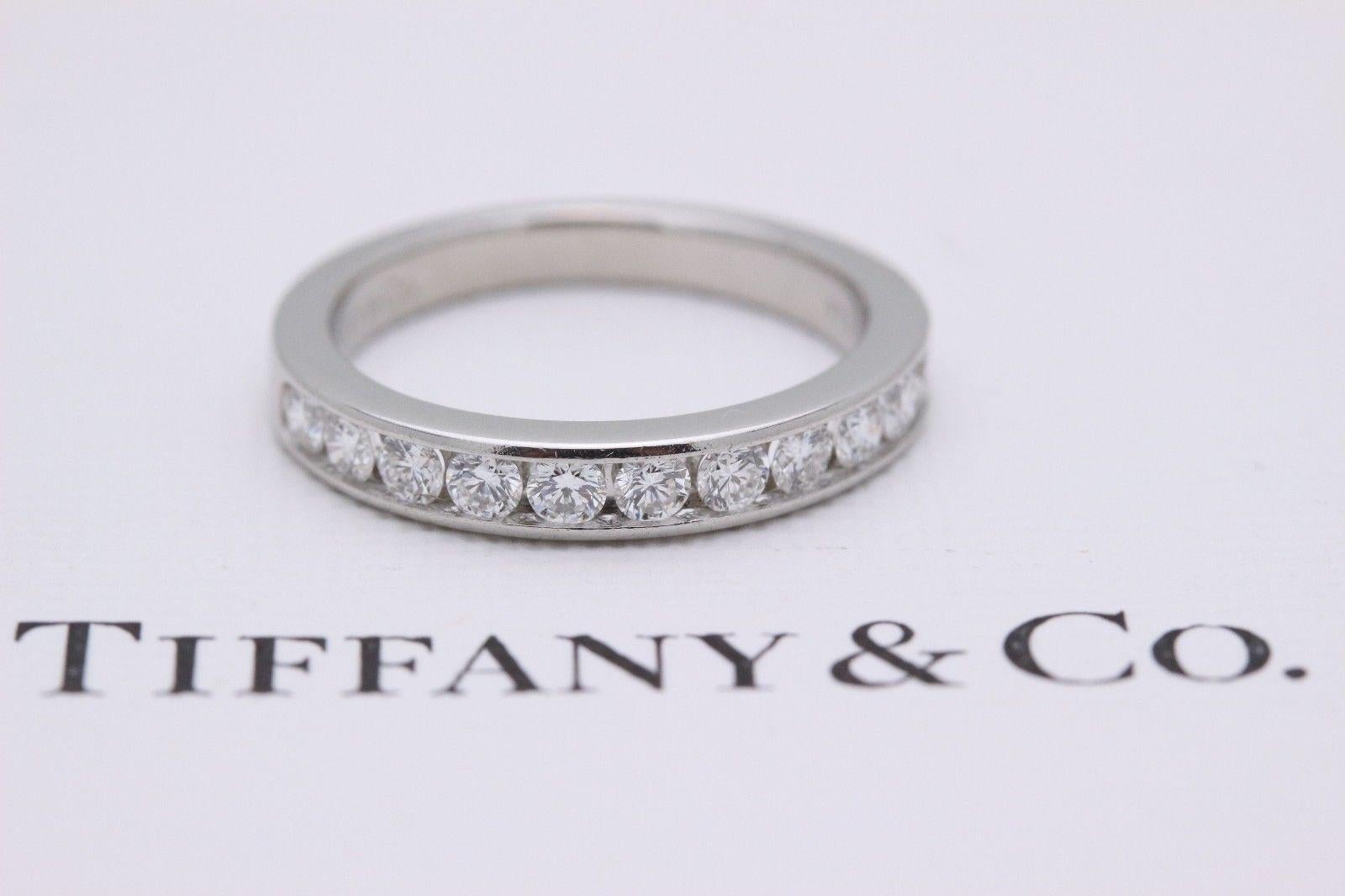 Tiffany & Co.
Style: Half Circle Diamond Wedding Band
Sku Number:  16183296
Size:  5.5 - sizable
Metal:  Platinum PT950
Total Carat Weight:  0.24 Cts.
Diamond Shape:  Round Brilliant 
Diamond Color & Clarity:  F-G  /  VVS-VS
Hallmark:  