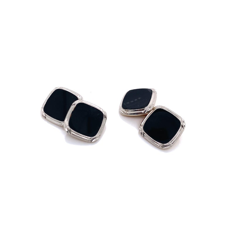 Created by Tiffany & Co., these cufflinks are perfect for any evening parties. 

- 14 karat yellow gold 
- Platinum and onyx 
- Signed Tiffany & Co.
- Set weight of 23.5 grams
- Length and width of 1.4 cm 
