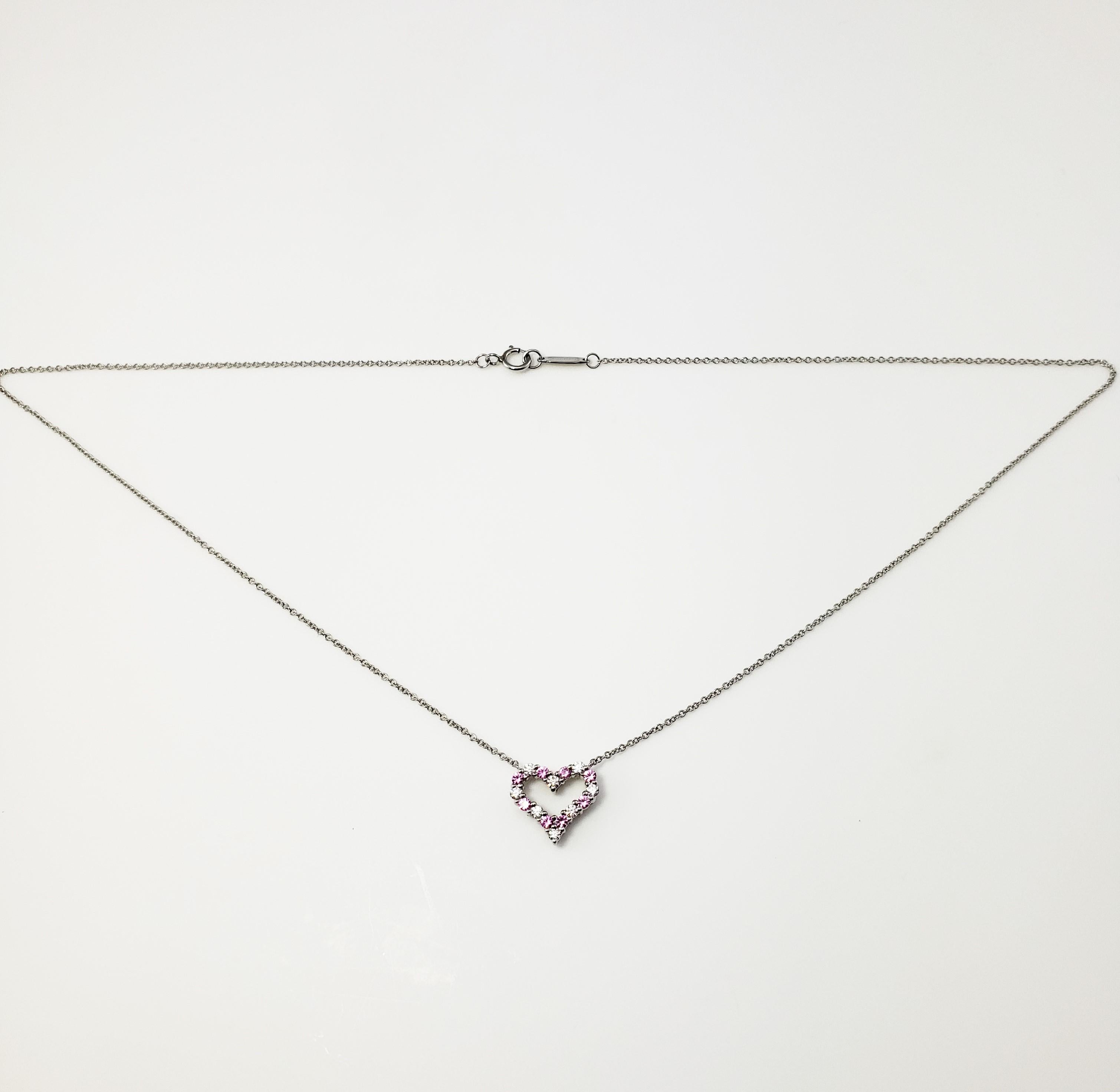 Vintage Tiffany and Co. Platinum Pink Sapphire and Diamond Heart Necklace-

This exquisite heart pendant features eight round brilliant cut diamonds and eight pink sapphires set in elegant platinum.

Approximate total diamond weight: .25