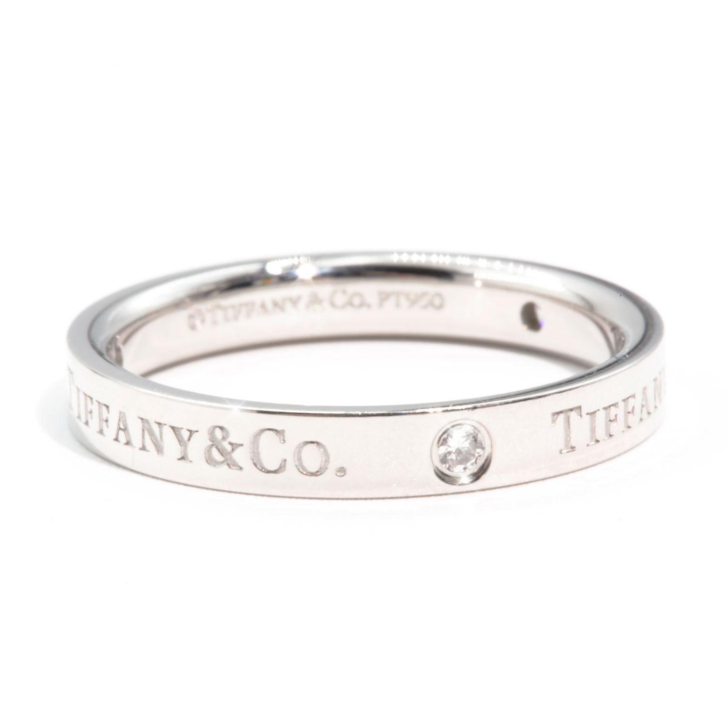Crafted in Platinum is this genuine Tiffany & Co Diamond Band Ring. The Tiffany & Co Diamond Band Ring measures 3 millimetres with 3 round brilliant diamonds.  A simply well made solid band that will last the test of time.  This ring is pre-loved