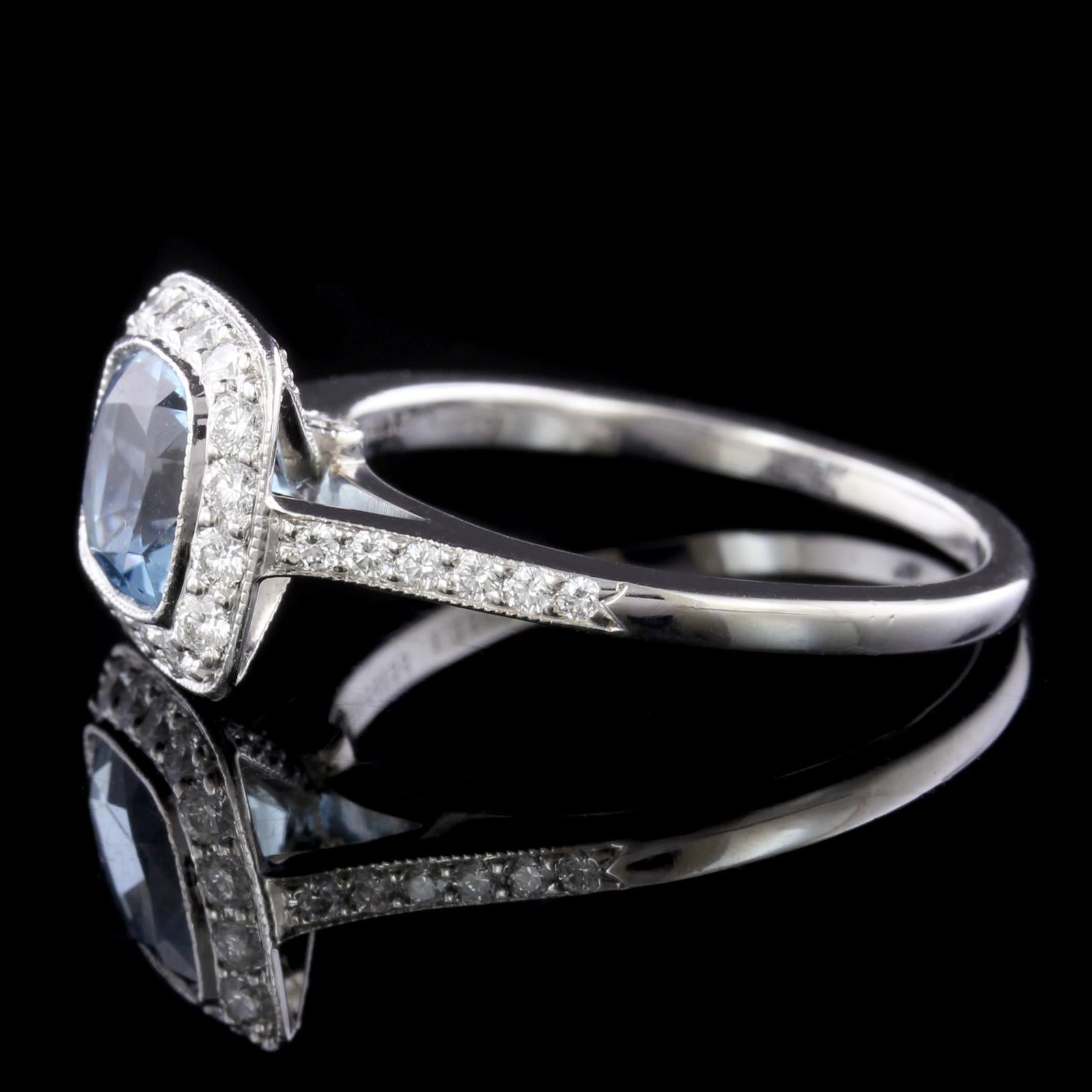 Tiffany & Co. Platinum Aquamarine and Diamond Legacy Ring. The ring is set with a cushion shaped aquamarine weighing 1.25cts., further set with 42 full cut diamonds, approx. total wt. .40cts., GH/VS, size 7 1/4.