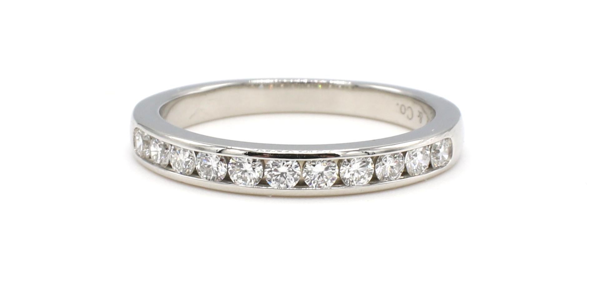 Tiffany & Co. Platinum Channel Set Diamond Wedding Band Ring 
Metal: Platinum
Weight: 4.49 grams
Diamonds: Approx. .55 CTW G VS round diamonds
Size: 7 (US)
Width: 3mm
Signed: Tiffany & Co. PT950
