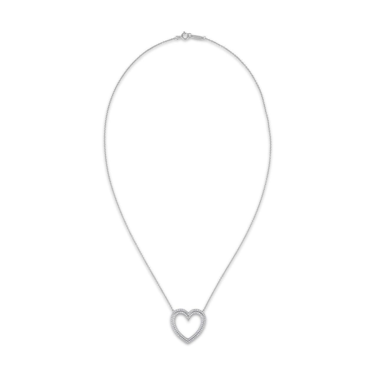 A stunning design from Tiffany & Co. large size Metro diamond heart collection. This pendant necklace is the perfect gift for someone special. It is crafted in solid platinum and boasts an open heart pendant with a double row of round cut sparkling
