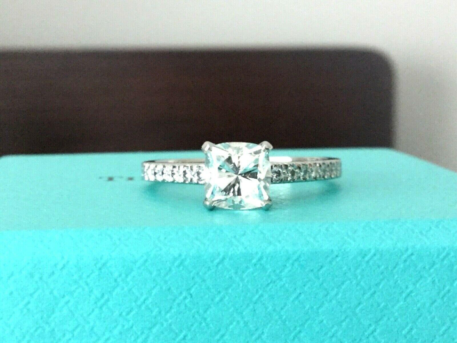 Being offered for your consideration is a like new Tiffany & Co Platinum and Diamond 1.09 carat natural cushion cut NOVO engagement ring set in the classic NOVO pave diamond band..  This ring is in amazing condition!  There are no marks or scratches