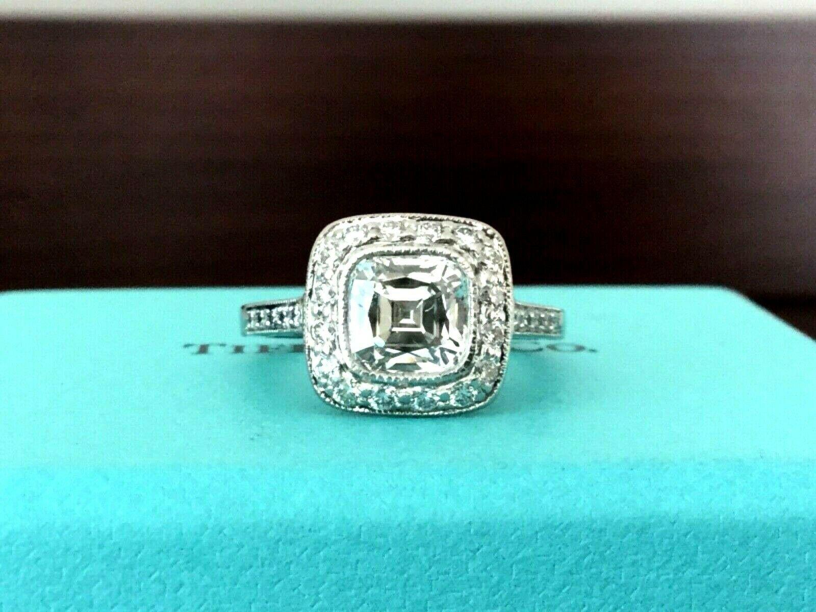 Being offered for your consideration is an amazing Tiffany & Co Platinum and Diamond 1.29 carat (1.71 TOTAL CARAT WEIGHT) natural cushion cut diamond engagement ring set in the classic LEGACY pave diamond band..  The diamond is HUGE on this amazing
