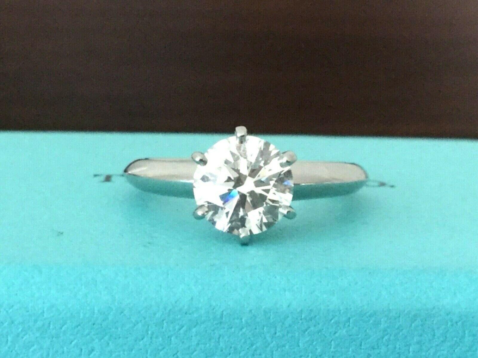 Being offered for your consideration is a like new Tiffany & Co Platinum and Diamond 1.87 carat natural round engagement ring set in the classic 6 prong setting. 

WORDS CANNOT DESCRIBE THIS AMAZING RING - This stunner is just about a 2 carat round