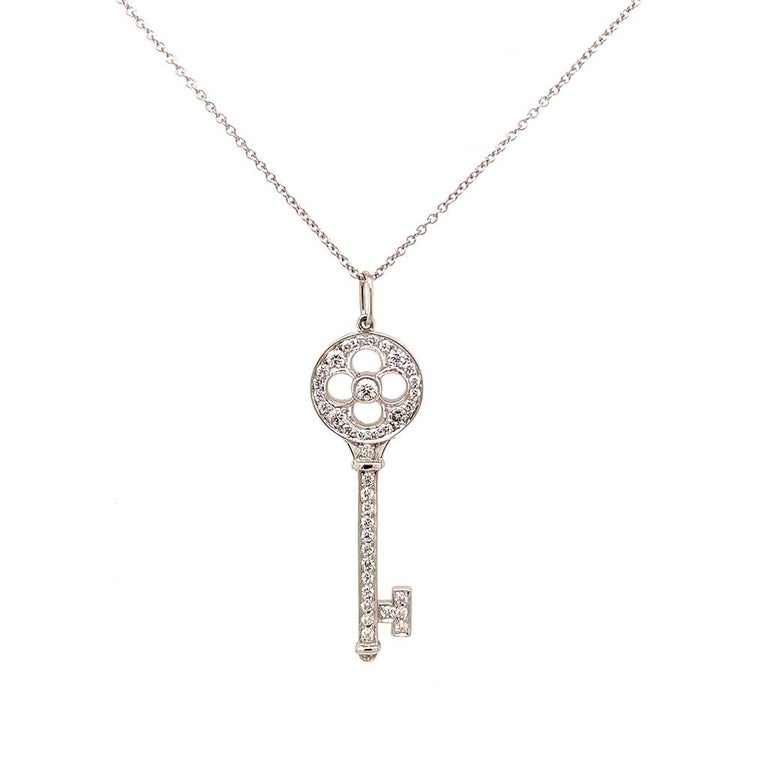 Round Cut Tiffany & Co. Platinum Diamond Rose Key Pendant Necklace, Estate For Sale