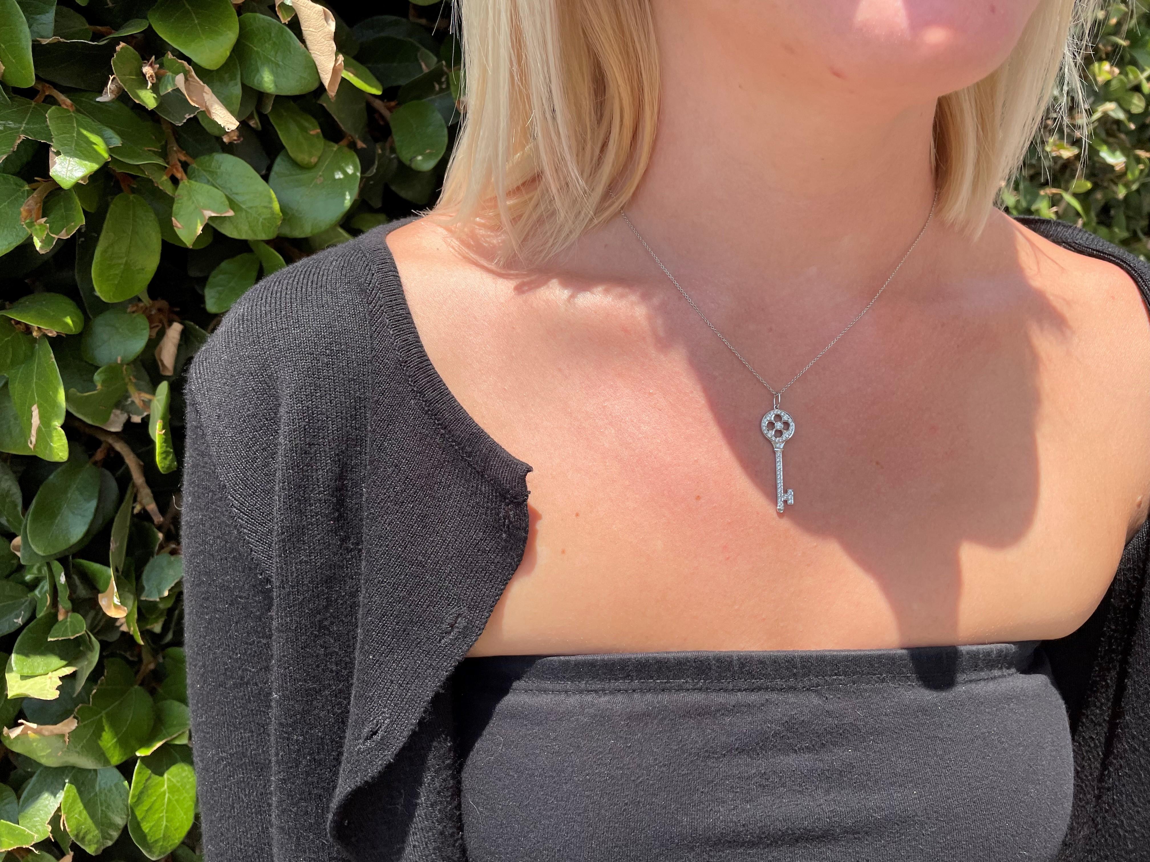 Round Cut Tiffany & Co. Platinum Diamond Rose Key Pendant Necklace, Estate For Sale