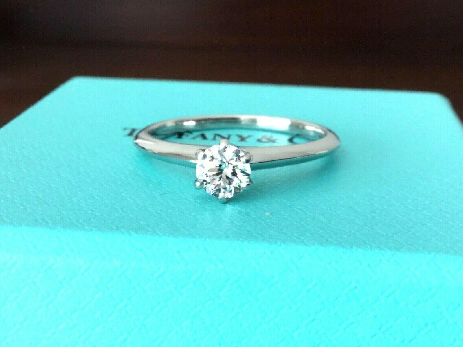 Being offered for your consideration is a like new Tiffany & Co Platinum and Diamond .46 carat natural round engagement ring set in the classic 6 prong setting. 

The ring has been professionally cleaned and polished to like new condition and
